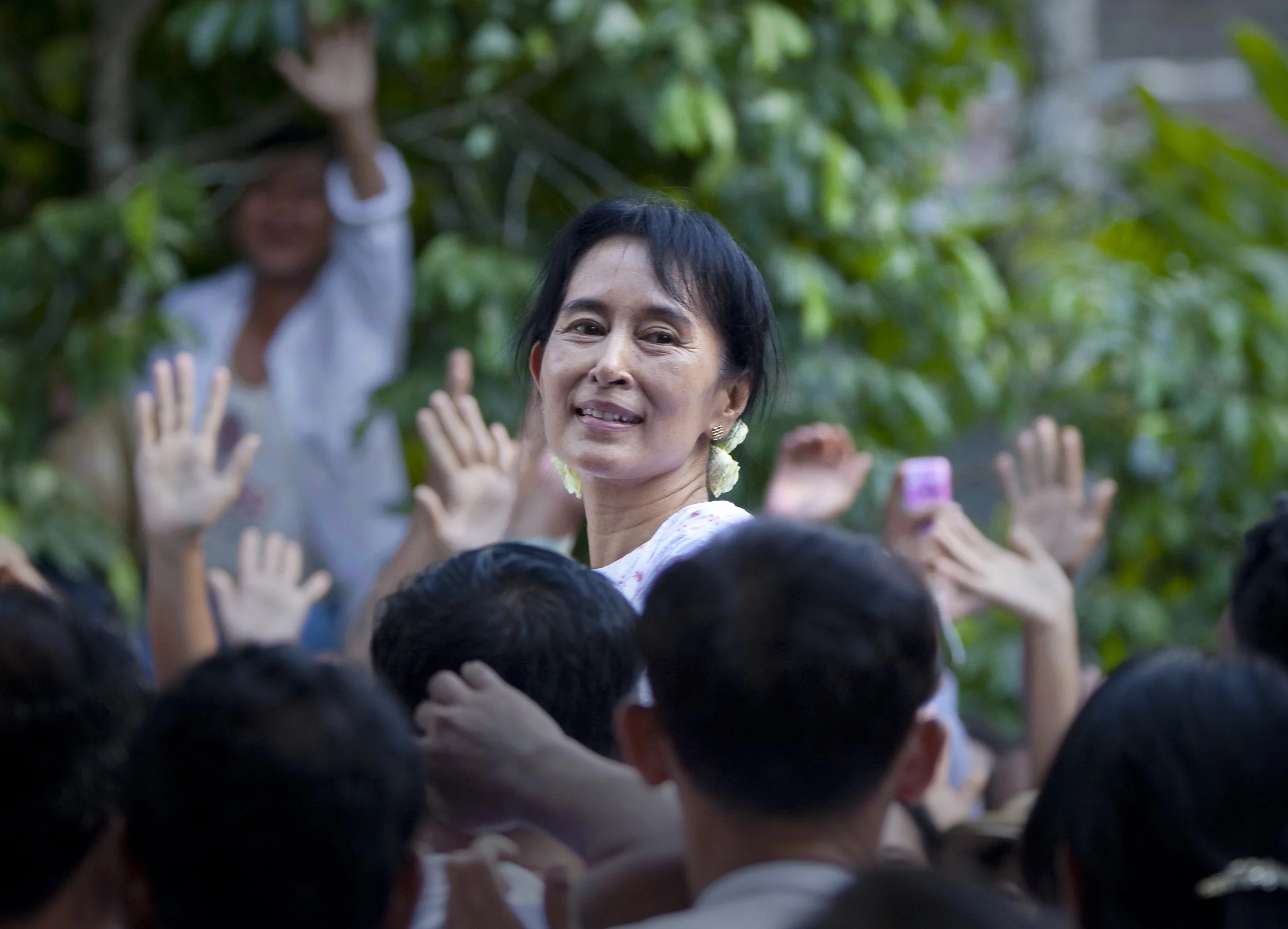 Burma's Aung San Suu Kyi is greeted by supporters in the days following her release from 15 years of house arrest. Rangoon, 2010.