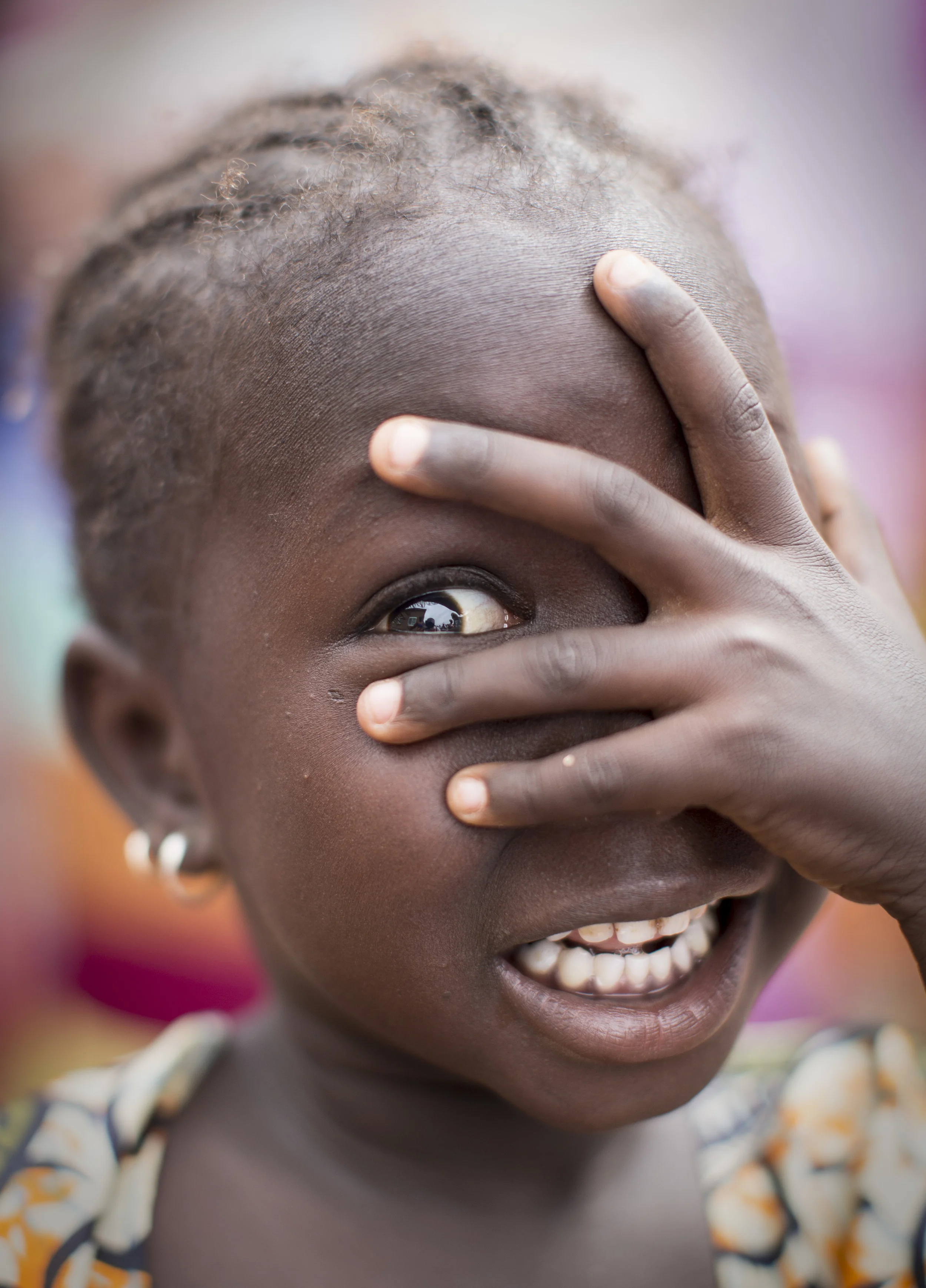  A young girl plays hide and seek in rural Senegal where 'Sightsavers' are &nbsp;combating trachoma. &nbsp;November 2013. 