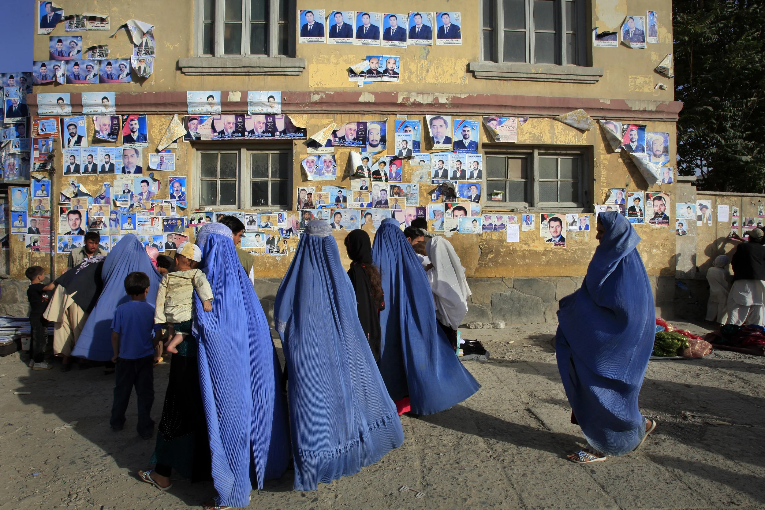  Afghan election posters adorn the walls of a building in central Kabul, Afghanistan, 2009. 