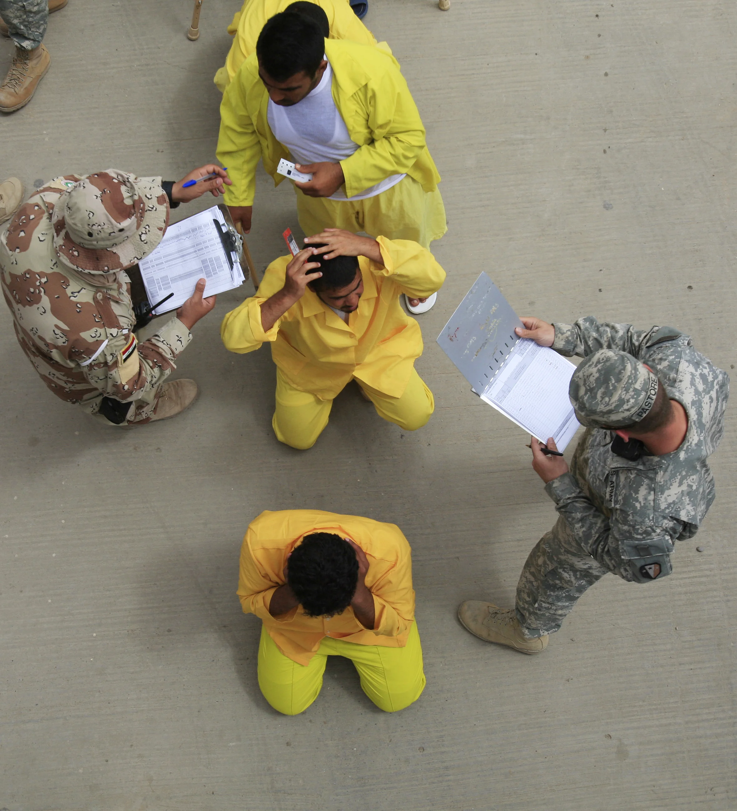 Iraqi detainees arrive at Camp Cropper, a prison run by the U.S. military for men suspected of being insurgents, during the 8 year occupation of Iraq. Baghdad, April 2009.