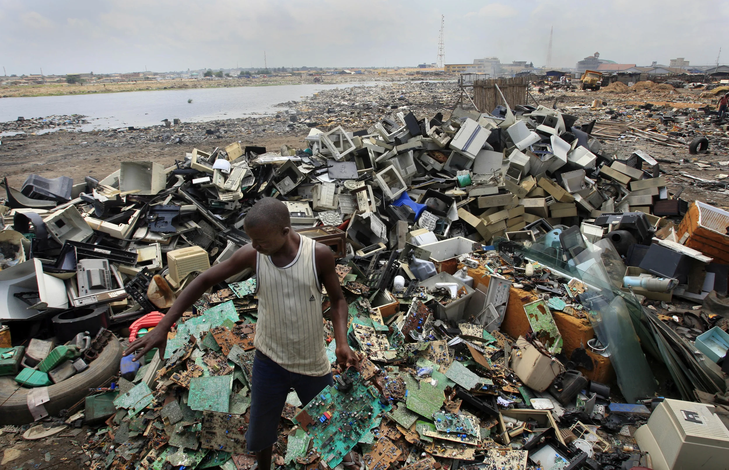 Computer salvagers at Agbogbloshie in Accra, Ghana, re-cycle the components of computers dumped from Europe and the West, with catastrophic environmental consequences. July 2009.