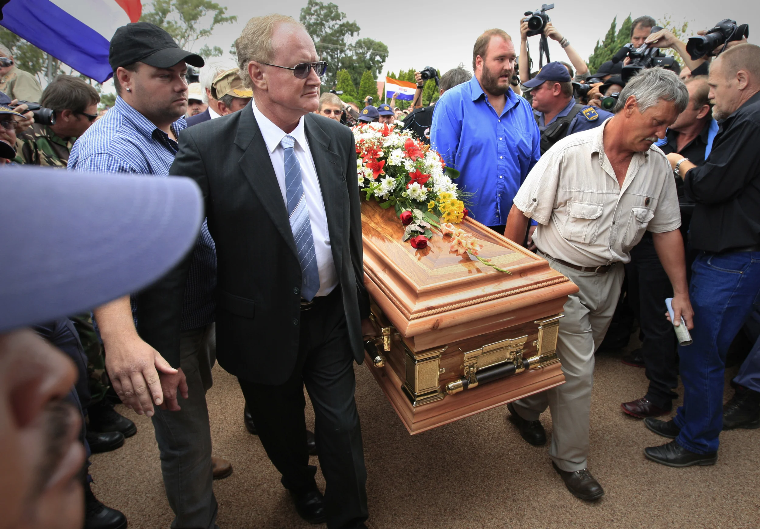 Mourners of the murdered AWB founder, Eugene Terre Blanche, carry his coffin at his funeral in Ventersdorp, South Africa. April 2010.