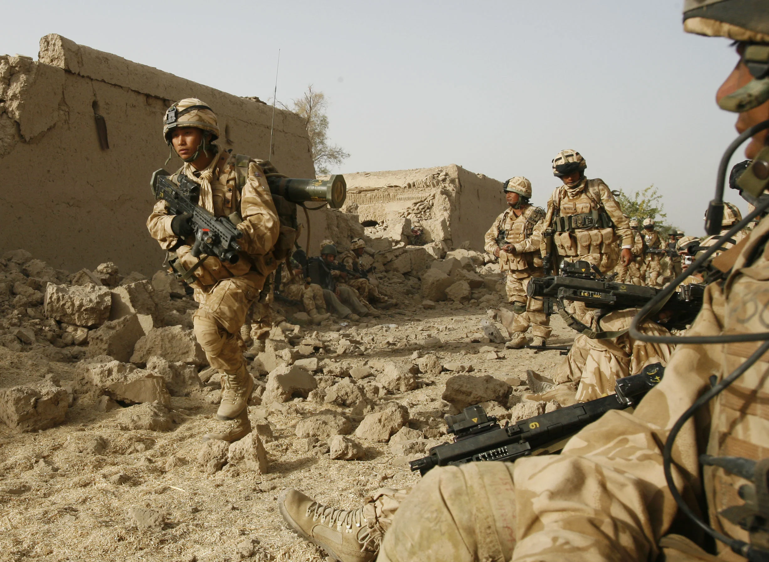 The Royal Gurkha Rifles of 'C' company, clearing a compound believed to have been used by Taleban, in the 'Green Zone' area of Hydarabad, Helmand Province, Afghanistan. September, 2007.