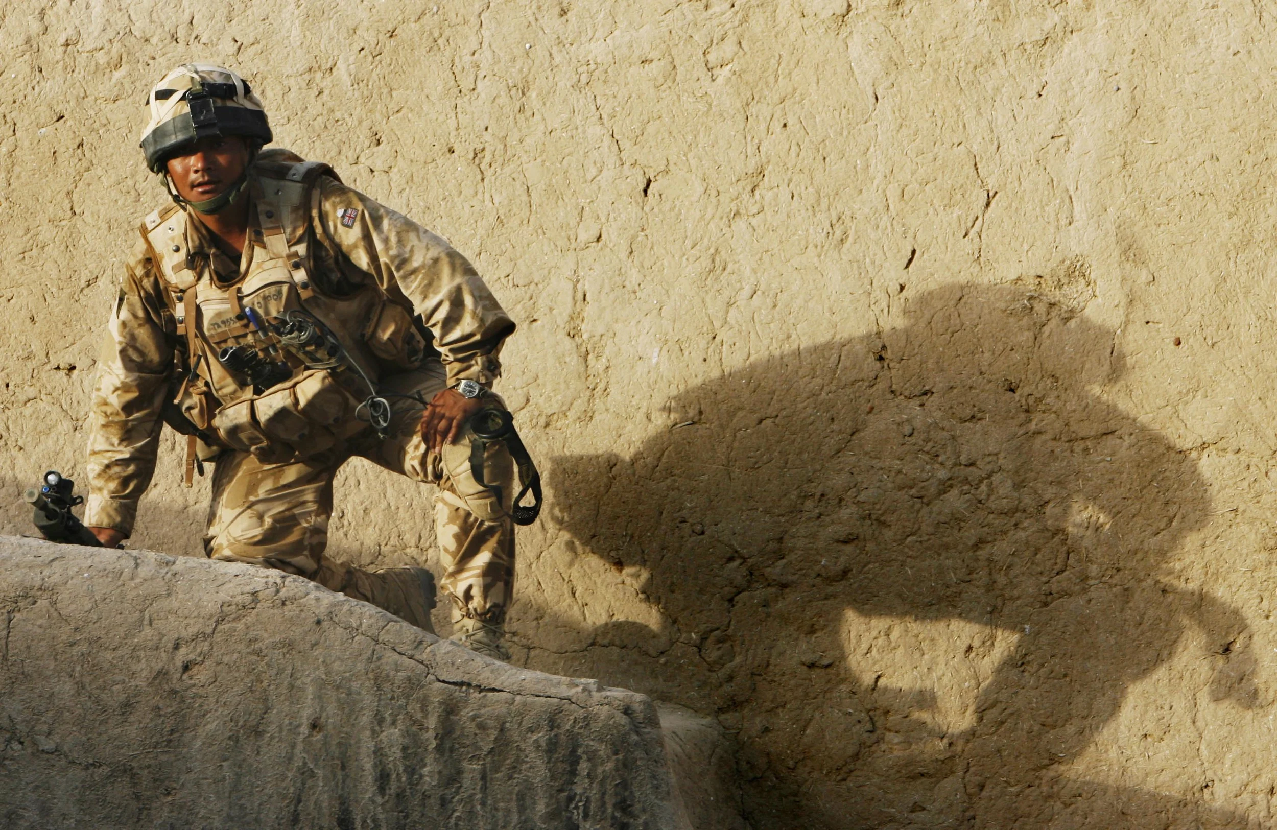 The Royal Gurkha Rifles of 'C' company, clearing a compound believed to have been used by Taleban, in the 'Green Zone' area of Hydarabad, Helmand Province, Afghanistan. September, 2007.