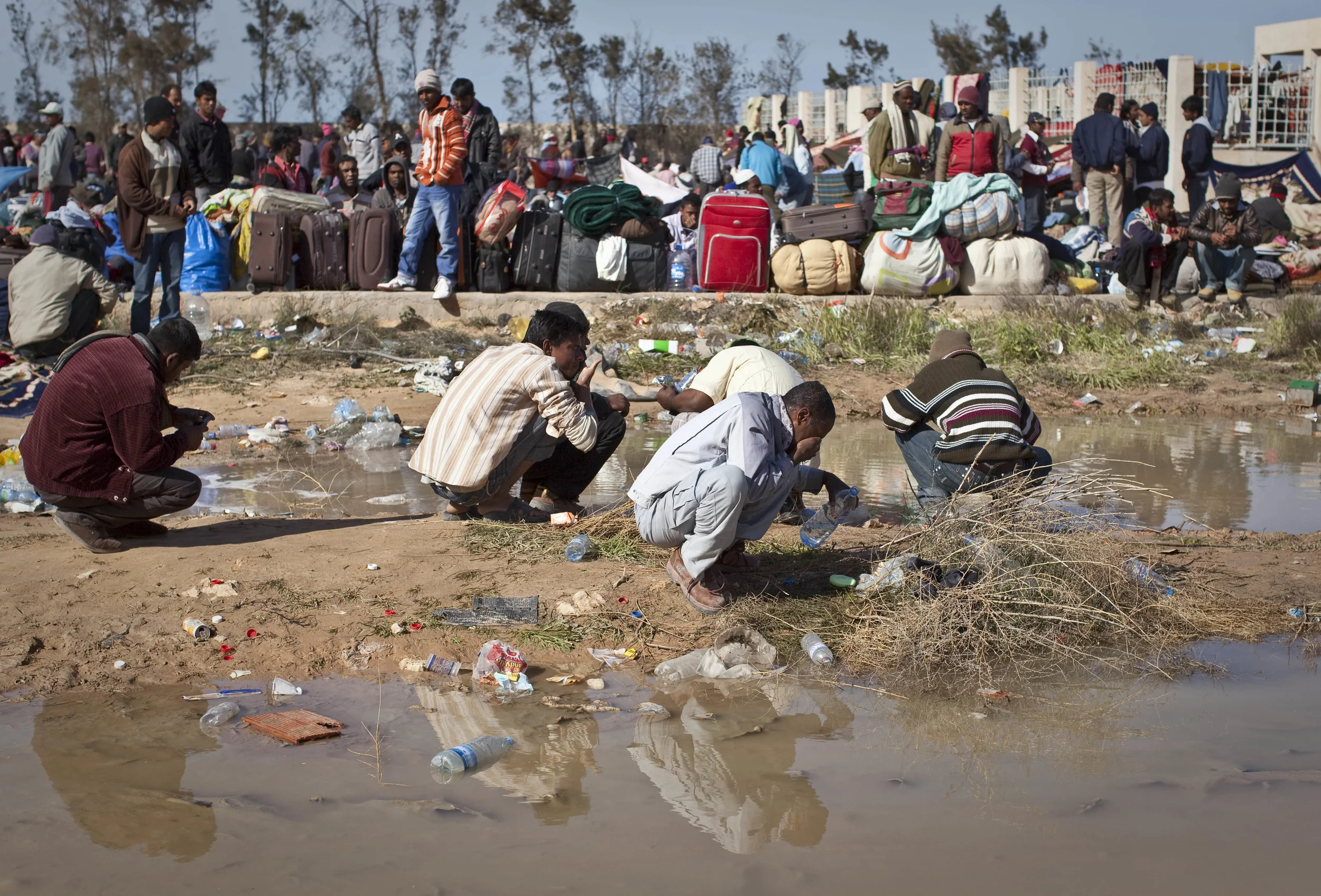  Bangladeshi refugees stranded at Ras Jdir, Tunisia, after fleeing Libya, following the growing violence and crisis there. March 2011. 