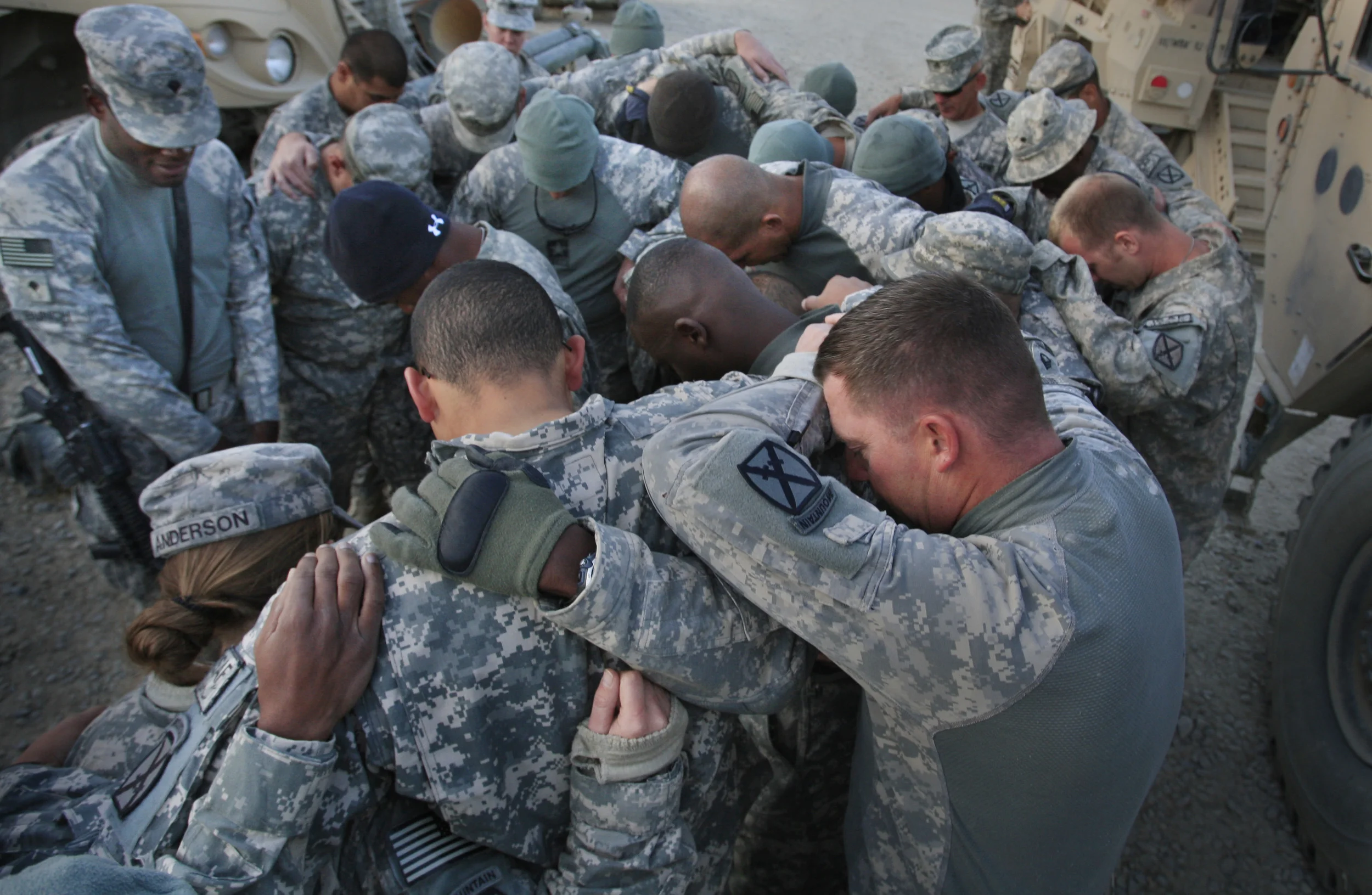 Pre mission prayers by U.S. soldiers of 10th Mountain Division, Wardak, Afghanistan, 2009.