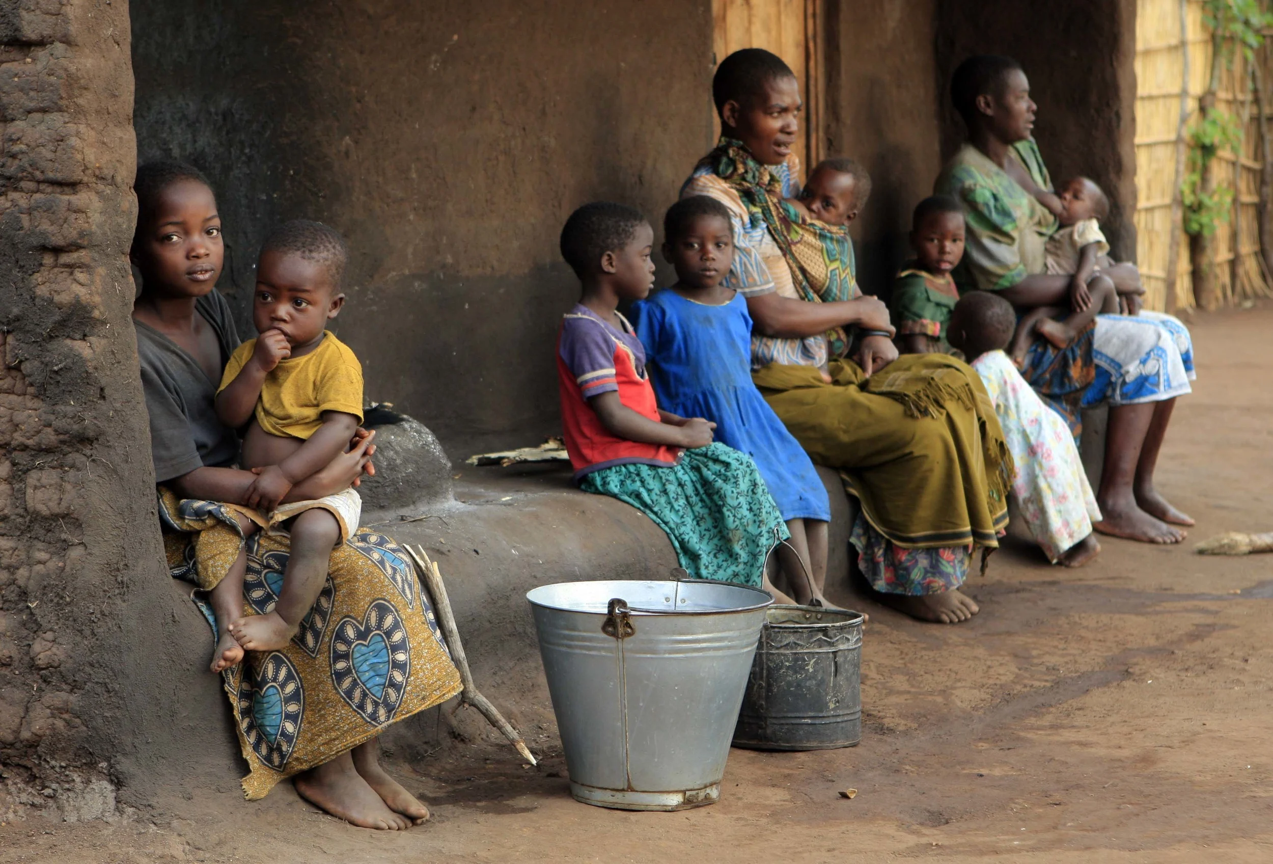  Women and children in the village Mwachilolo. 'Pump Aid' recently installed an Elephant water pump and elephant toilet. &nbsp;November 2008 