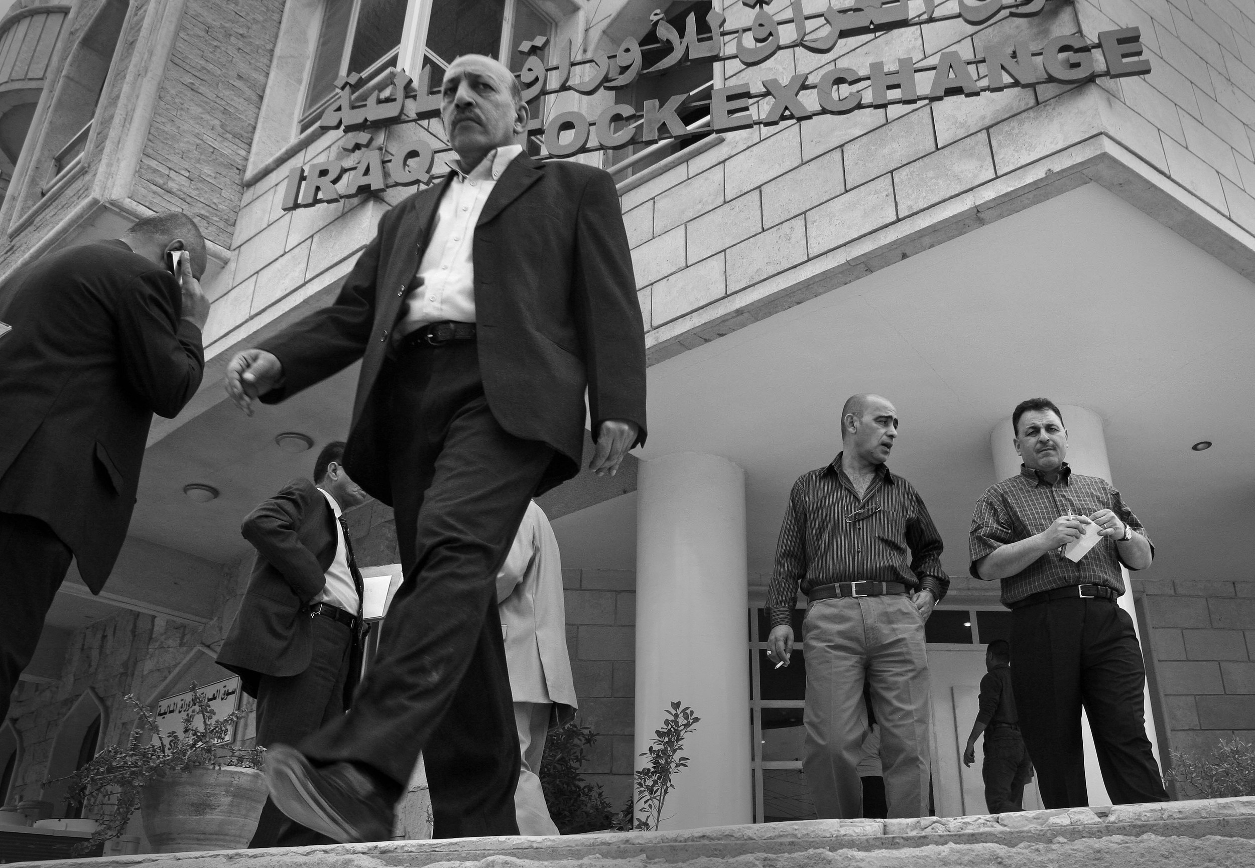Investors leaving the Iraqi stock exchange in Baghdad after the close of the morning trading session. March, 2009.
