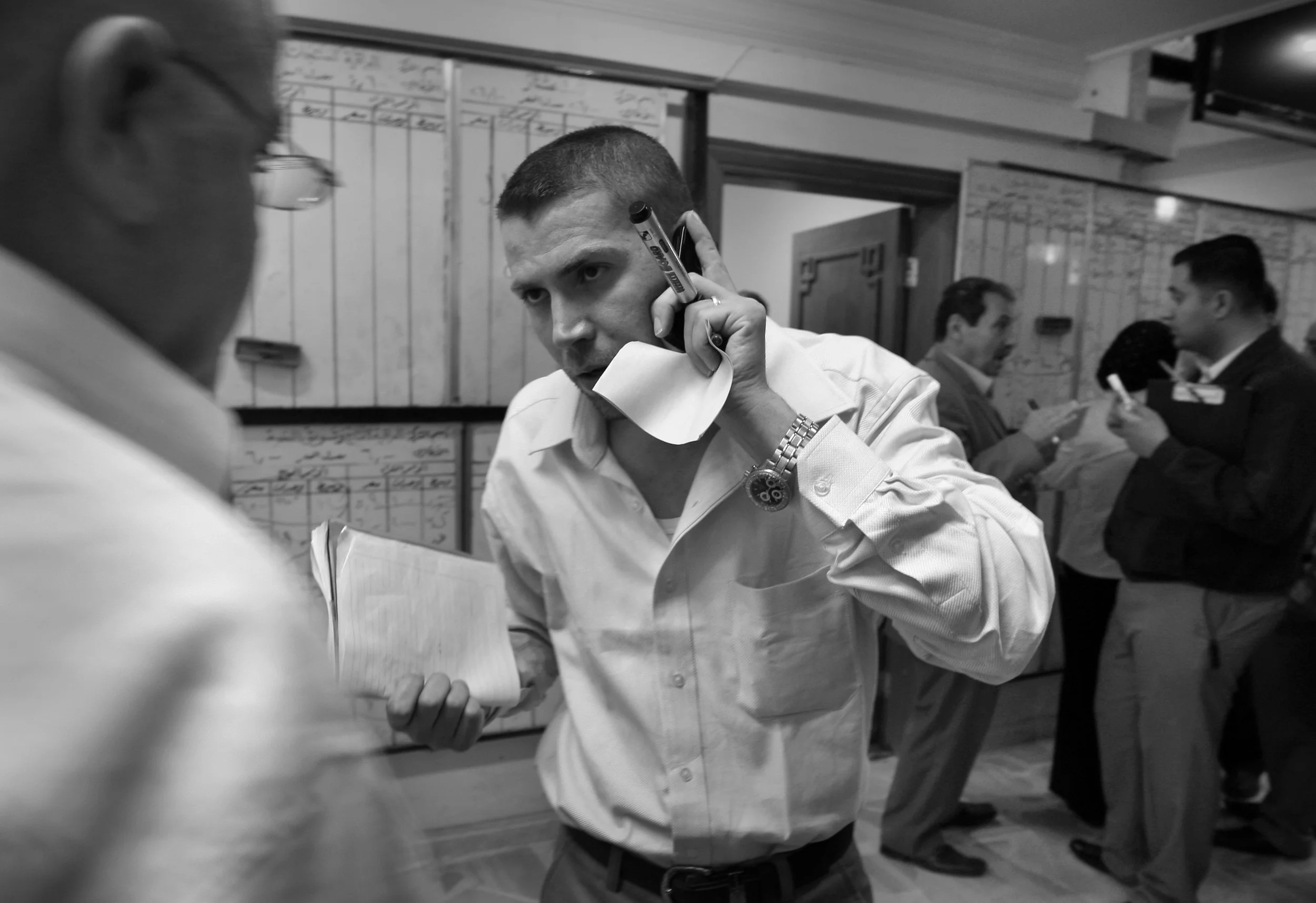 An employee of the Iraq Stock Exchange, Baghdad, during a trading session. March, 2009.