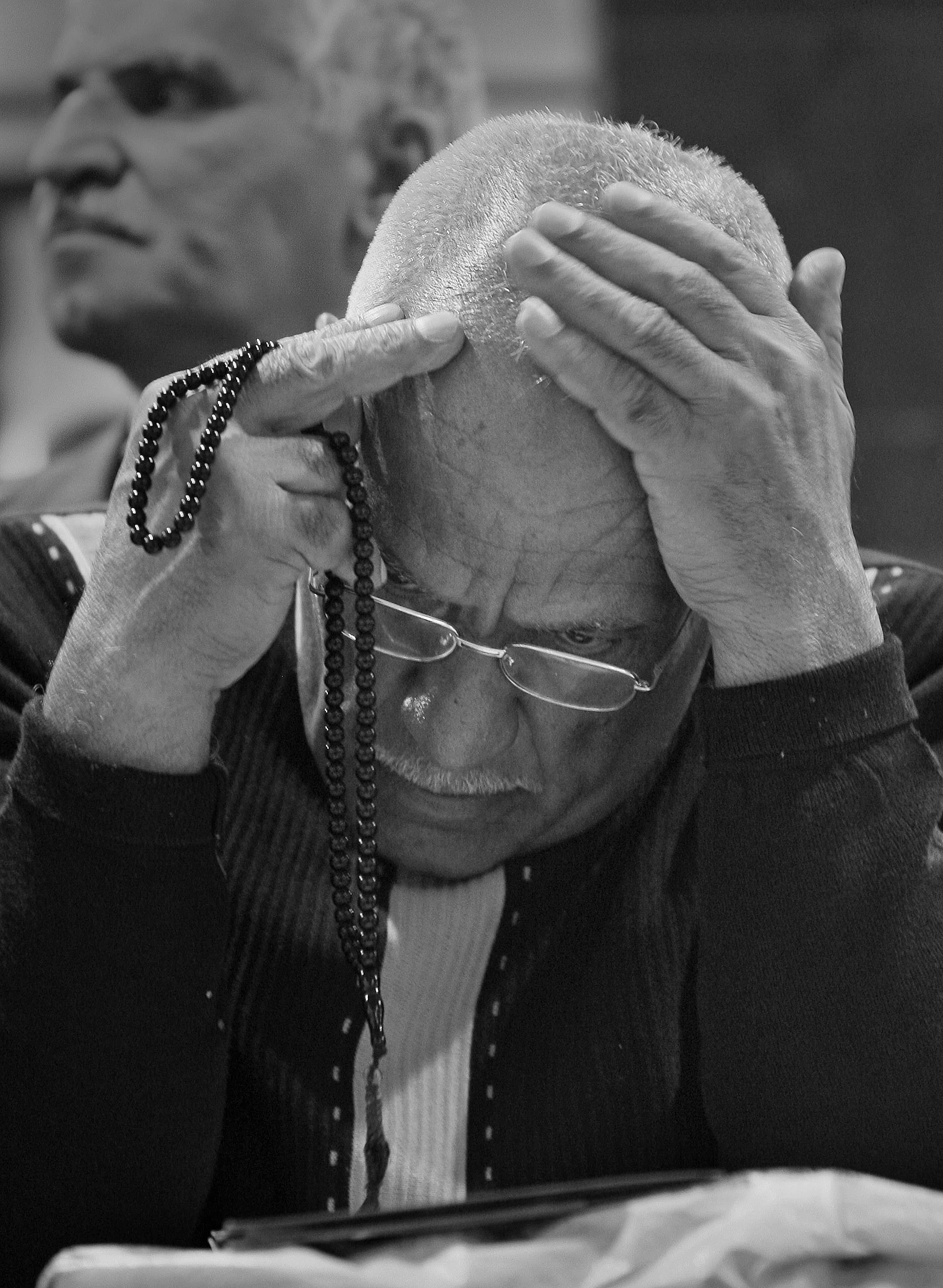 An investor contemplates his dealings at the Iraqi stock exchange in Baghdad, during a morning session. March, 2009.