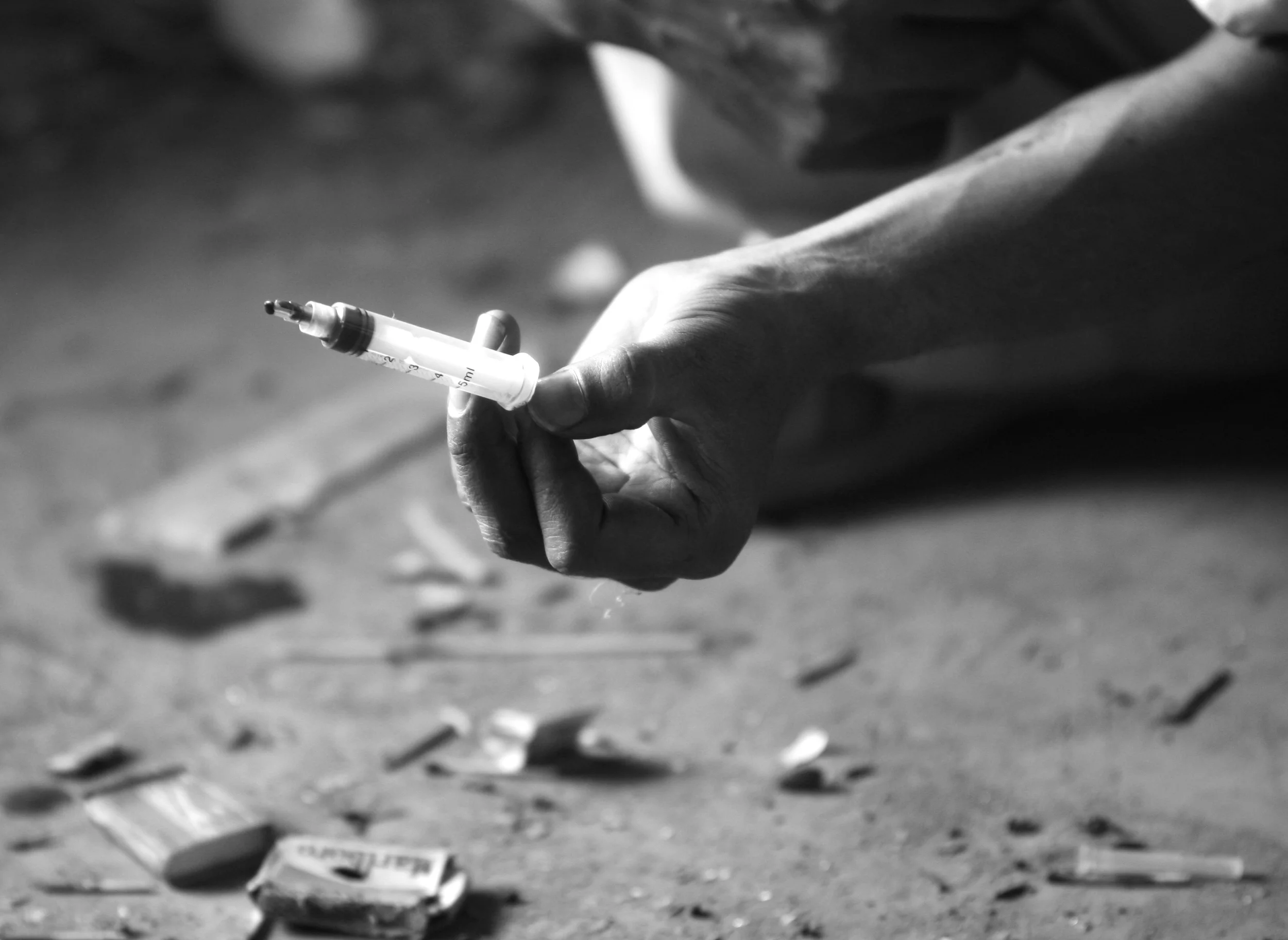  The dirty syringe with a shortened, broken needle, immediately after a user injected himself in the destroyed, former Russian Cultural Centre, a haven for drug addicts in Kabul, Afghanistan. &nbsp;September, 2009.   