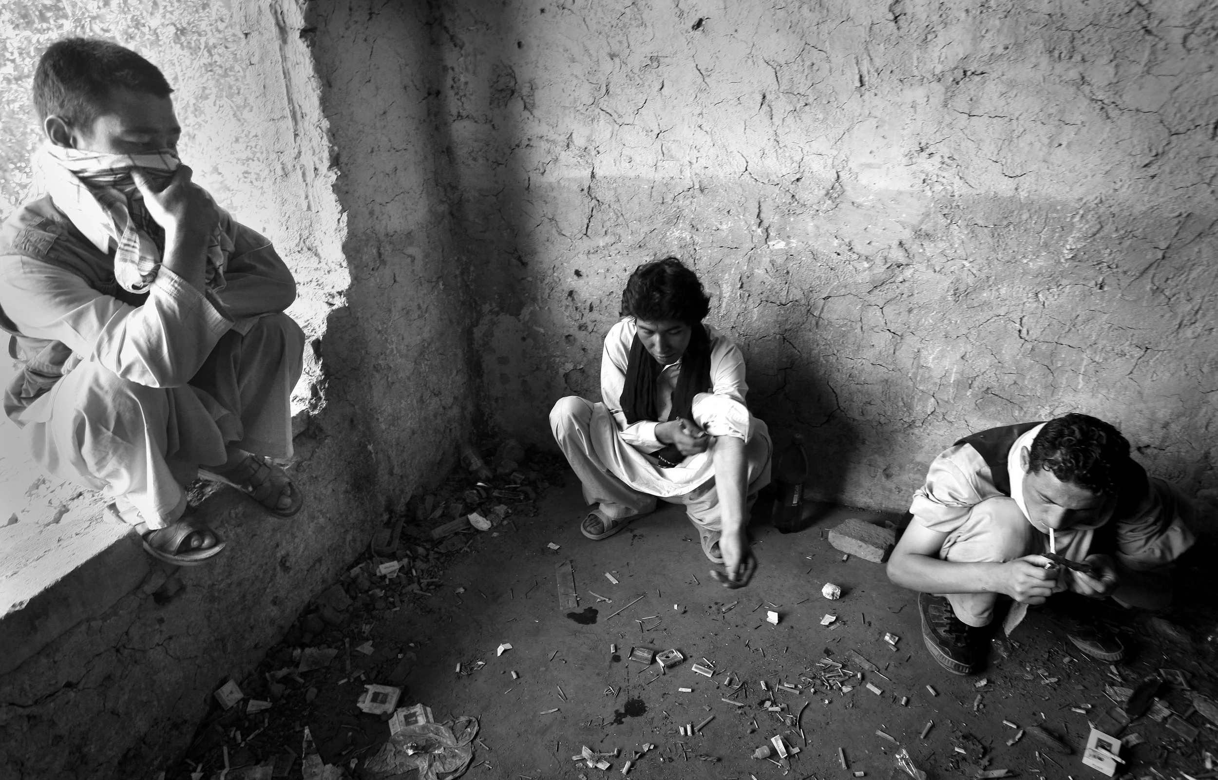  Drug users in the destroyed, former Russian Cultural Centre, a haven for drug addicts in Kabul, Afghanistan. September, 2009. 