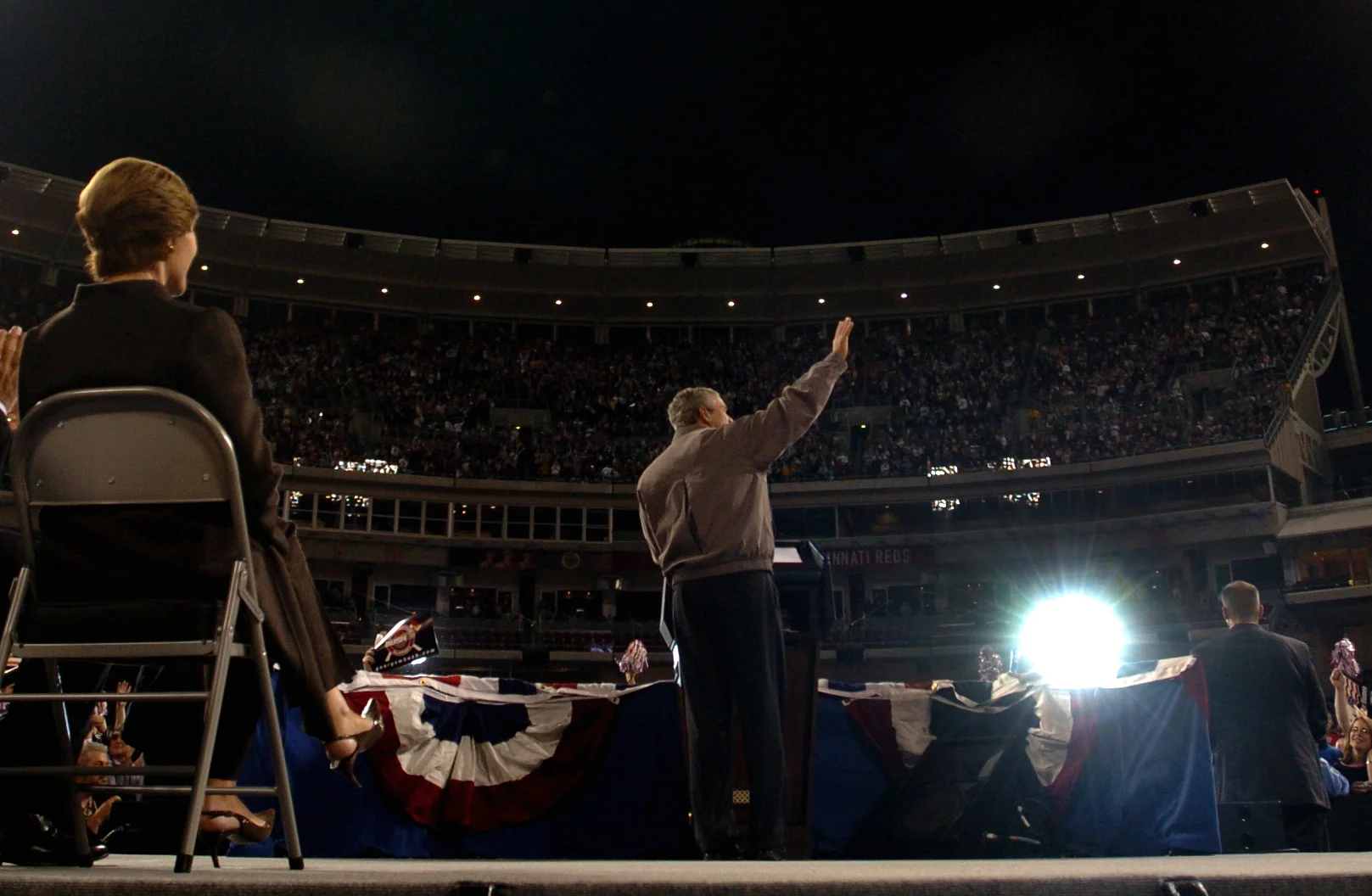  Laura Bush looks on as President George W Bush acknowledges his supporters during a rally in Cincinatti, Ohio, in the run-up to the U.S. presidential election. November, 2004. 