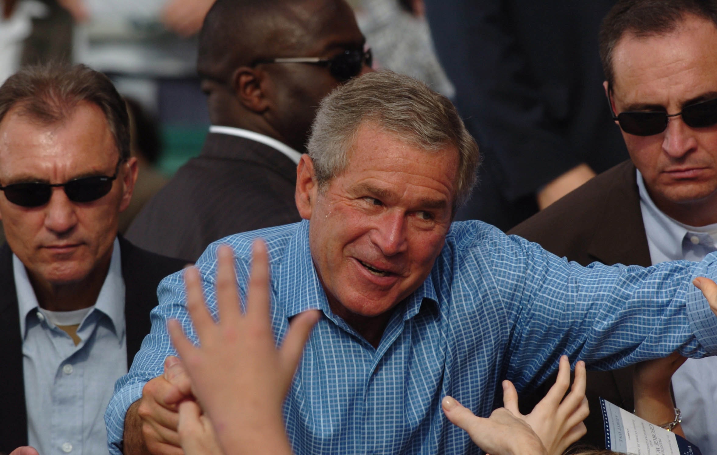  President George W Bush greets supporters at an election rally in St. Petersburg, Florida. October, 2004. 