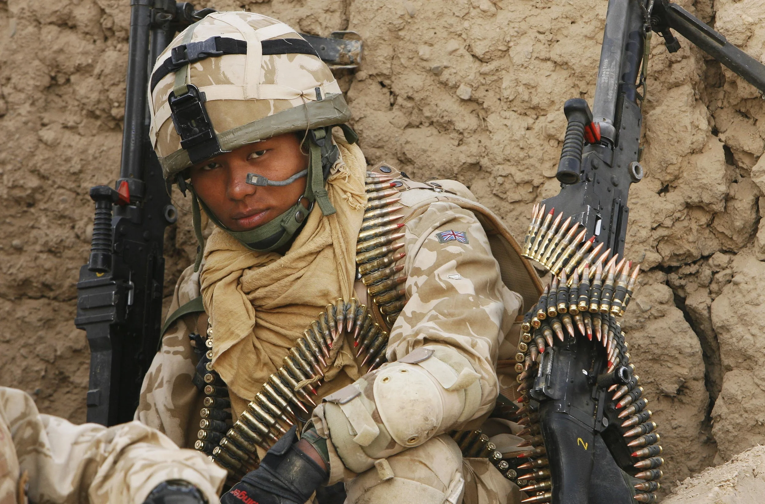  A machine-gunner of 'C' company, The Royal Gurkha Rifles, pauses during the securing of a compound in the 'Green Zone' area of Hydarabad, Helmand Province, Afghanistan. &nbsp;September, 2007.   