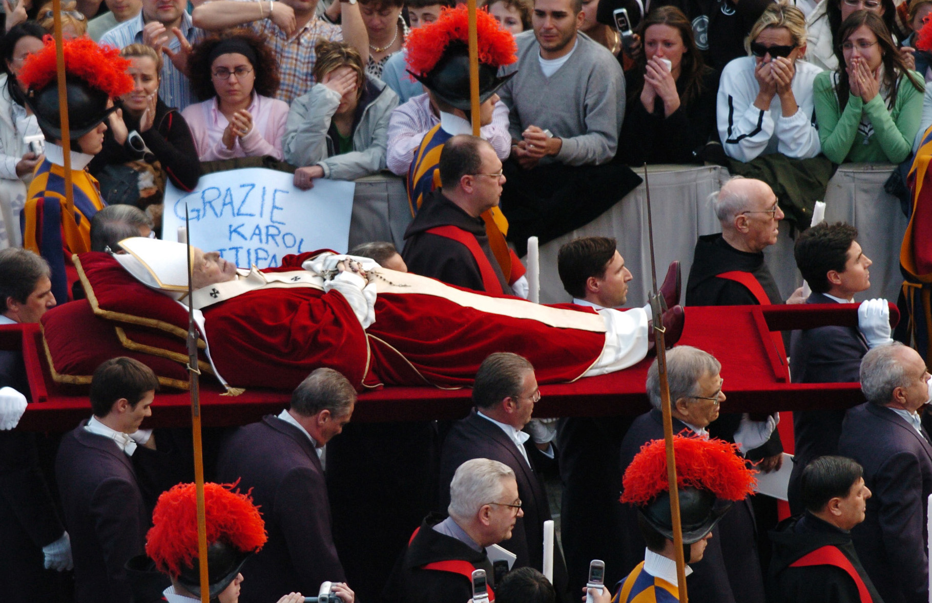  Pope John Paul II carried past mourners in St. Peters square, the Vatican, following his death. April, 2005    