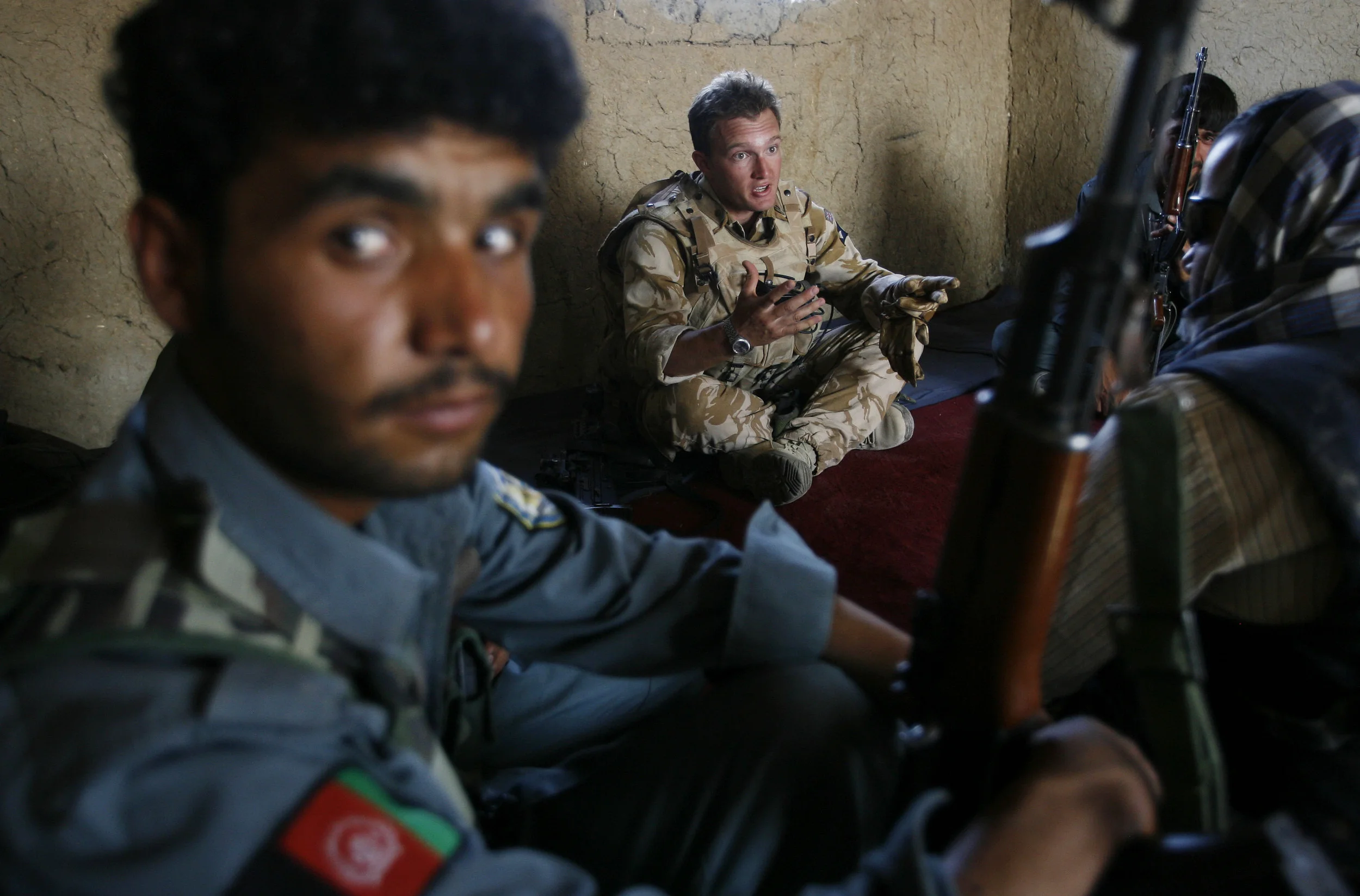  Capt. James Johnson of 5 Rifles, during a meeting with Afghan National Police at a checkpoint in Gereshk, Afghanistan, 2007. 