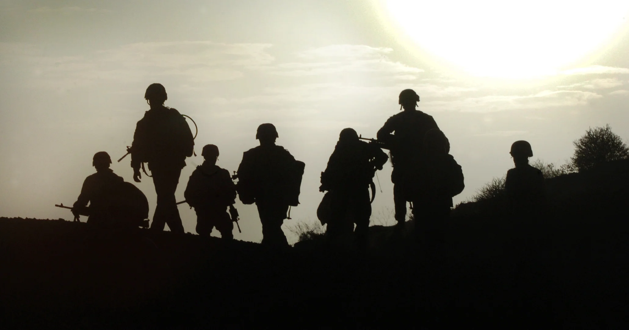  U.S. soldiers of 2nd Battallion, 503rd Infantry, ahead of a dawn raid on a compound in Zabul, Afghanistan, 2005. 
