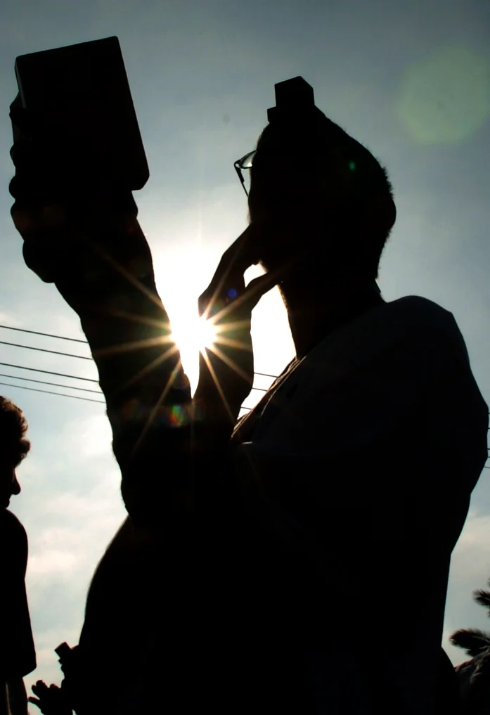  A young settler prays at his settlement in Gush Katif, Gaza, during Israel's disengagement from the territory. &nbsp;August 2005. 