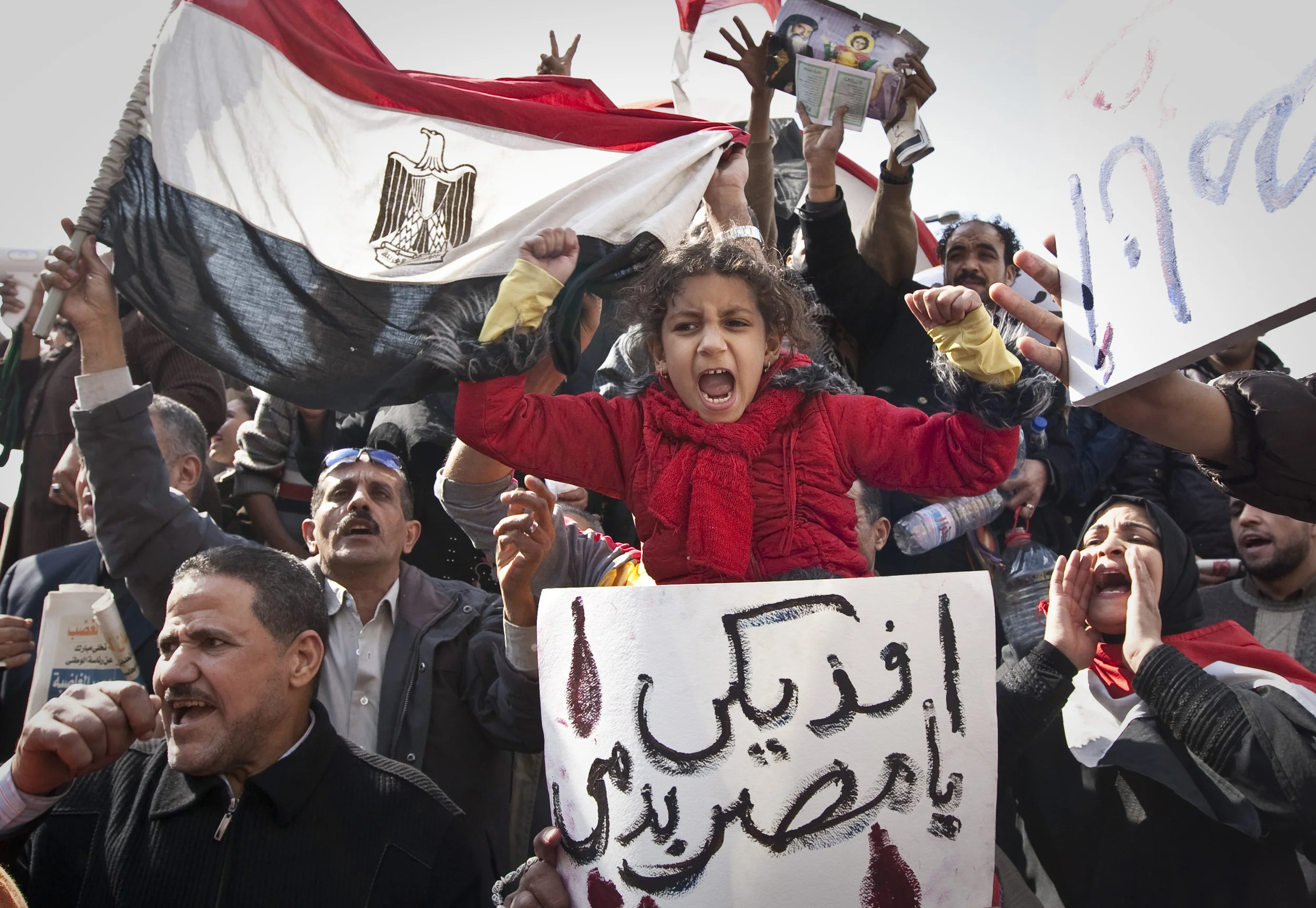  Egyptians including families with children, demonstrate in Tahrir Square, Cairo, calling for the removal of Hosni Mubarak as President, 2011. 