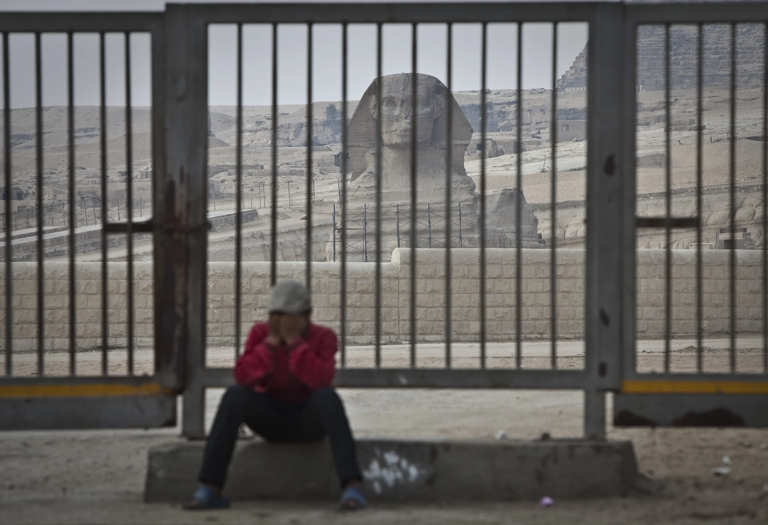  An anxious resident of Giza at the closed area around the pyramids, where no tourists visited during the rioting in Tahrir square, Cairo, 2011. 
