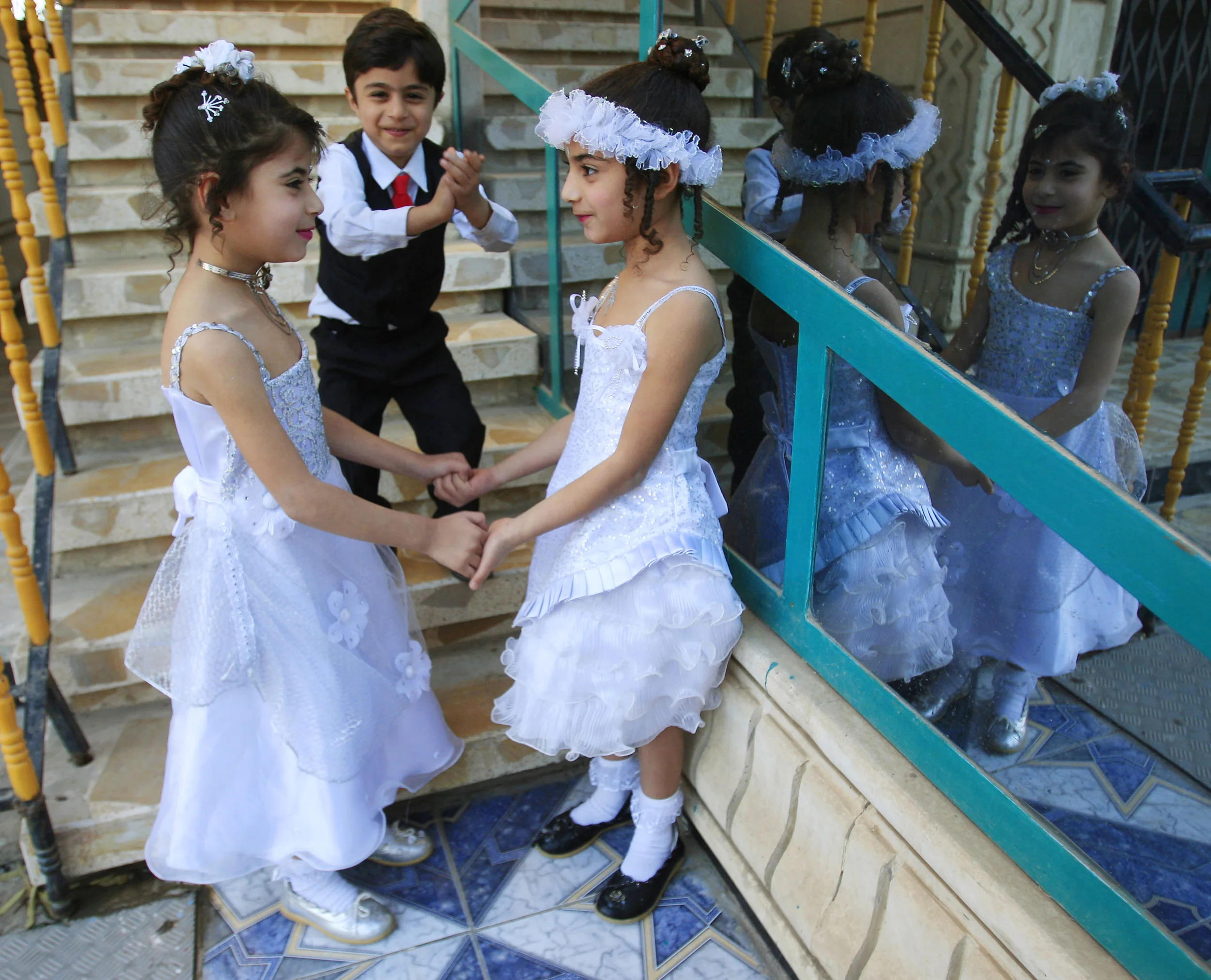  Young children play at an engagement party in Basra, southern Iraq, as confidence that peace and normality are returning grows. &nbsp;April 2010.    