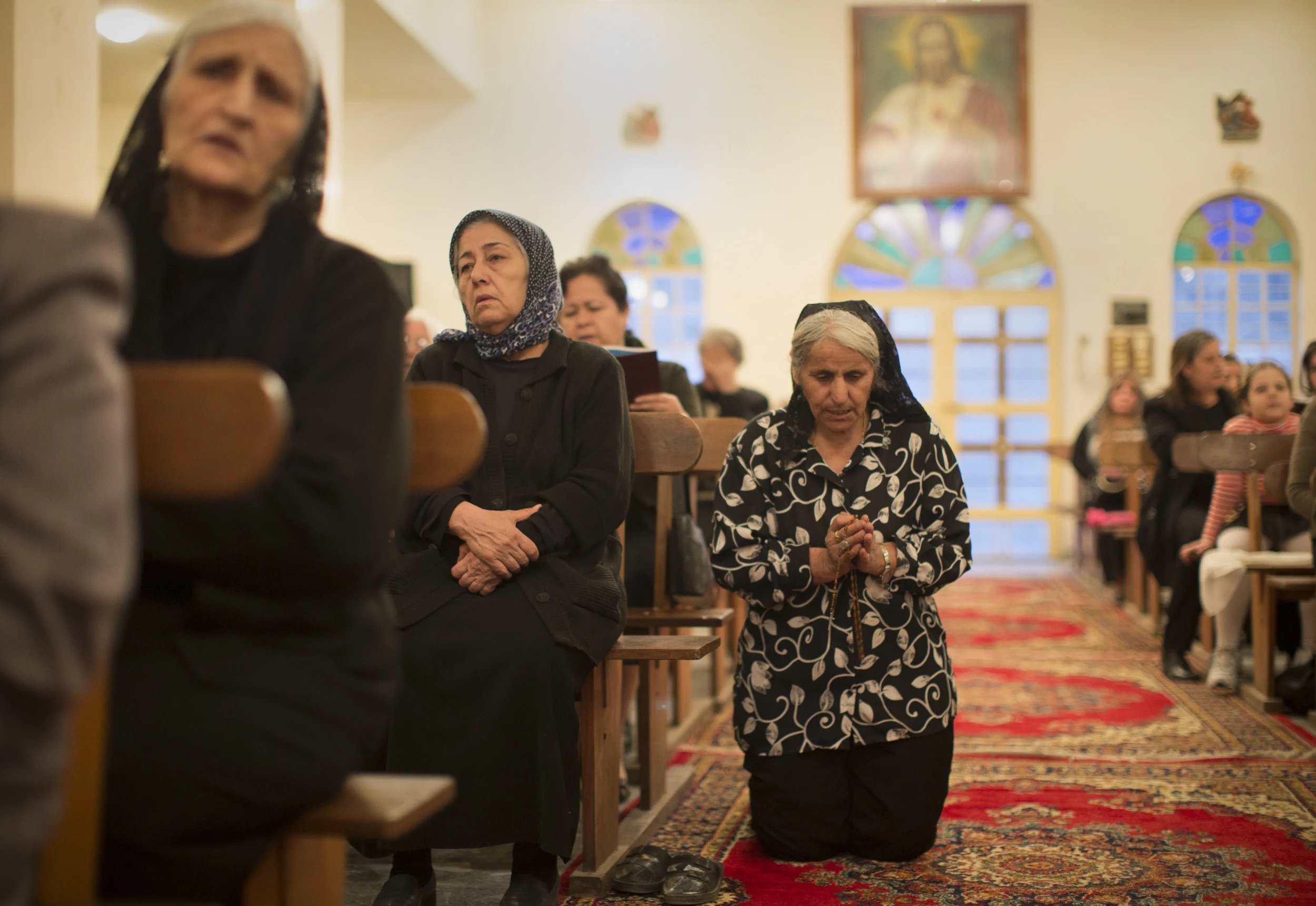  Christians attend a service at 'St. Joseph's' church in Baghdad. The Christian population of Iraq has depleted dramatically in the past decade, with most leaving the country. March 2013. 