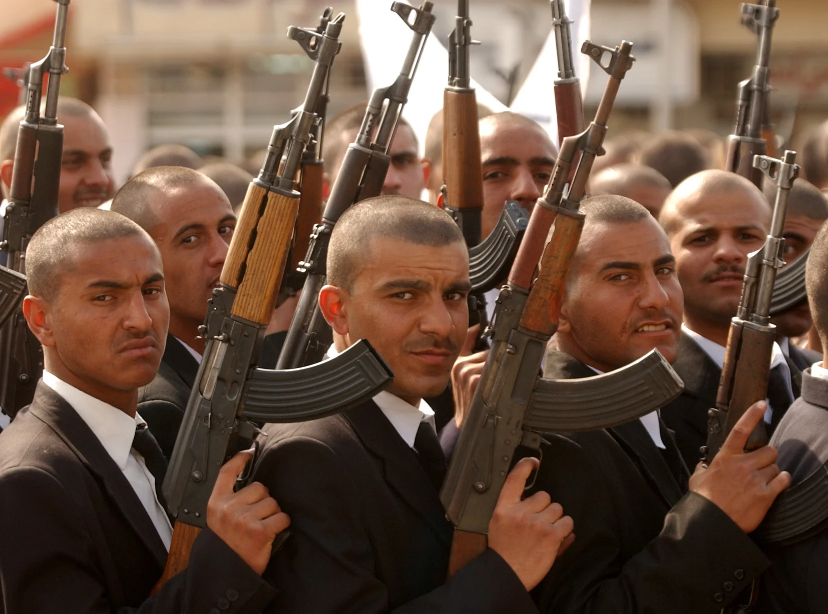  Cadets from the Iraq Police Academy, march at a pro-Saddam Hussein rally before the start of 'Shock and Awe'. Baghdad, February 2003. 