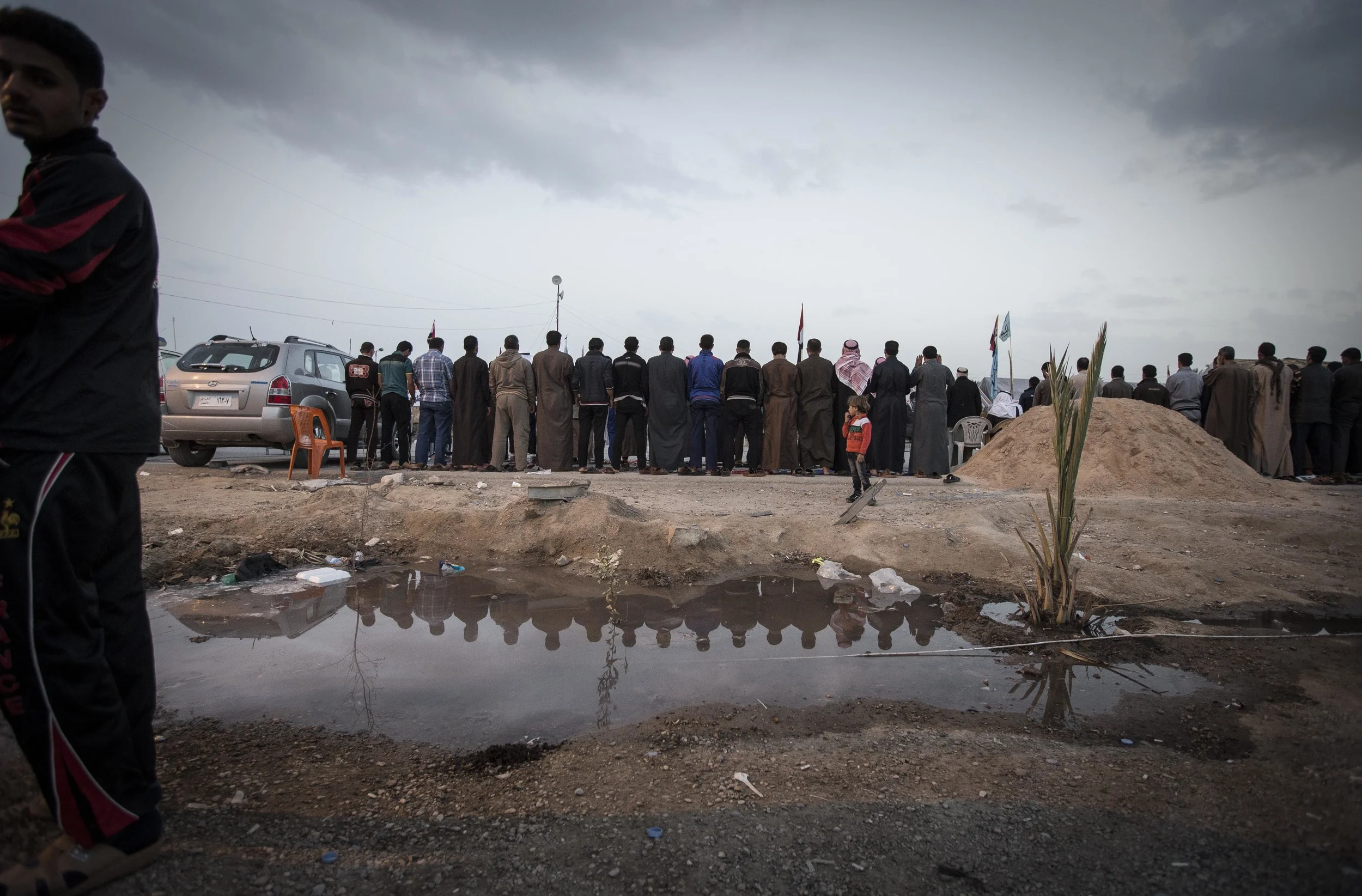  Anti government protesters at a camp in Anbar province, Iraq, pray at dusk, as they continue their ten week protest their against Prime Minister, Nouri al-Maliki. &nbsp;Ramadi, Iraq, March 2013. 