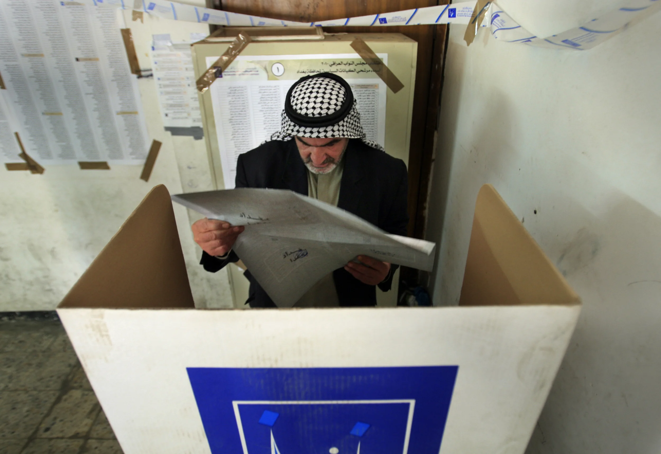  An Iraqi casts his vote at a polling station in the Karada district of Baghdad, in the country's presidential elections. &nbsp;March 2010. 