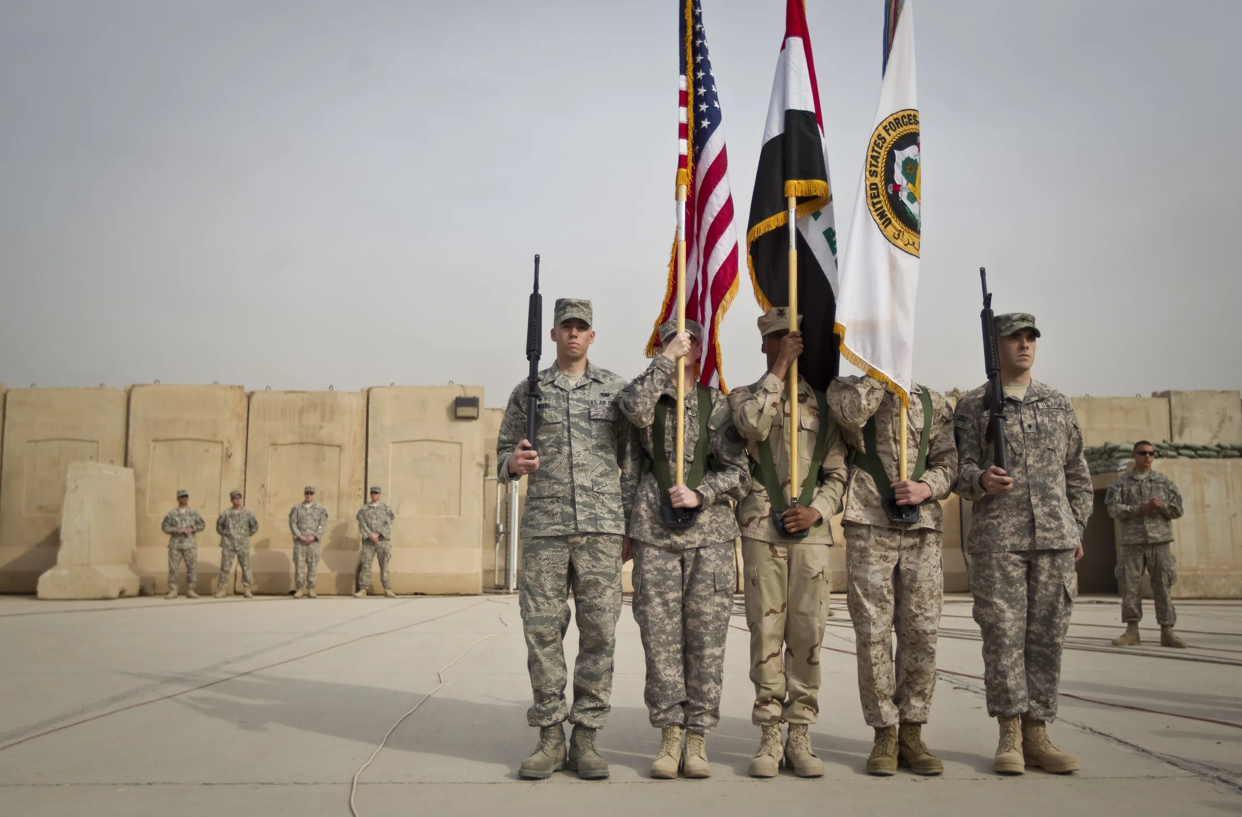  US Forces standard bearers arrive at the ceremony marking the Americans end of mission in Iraq, at Baghdad airport. December 2011. 