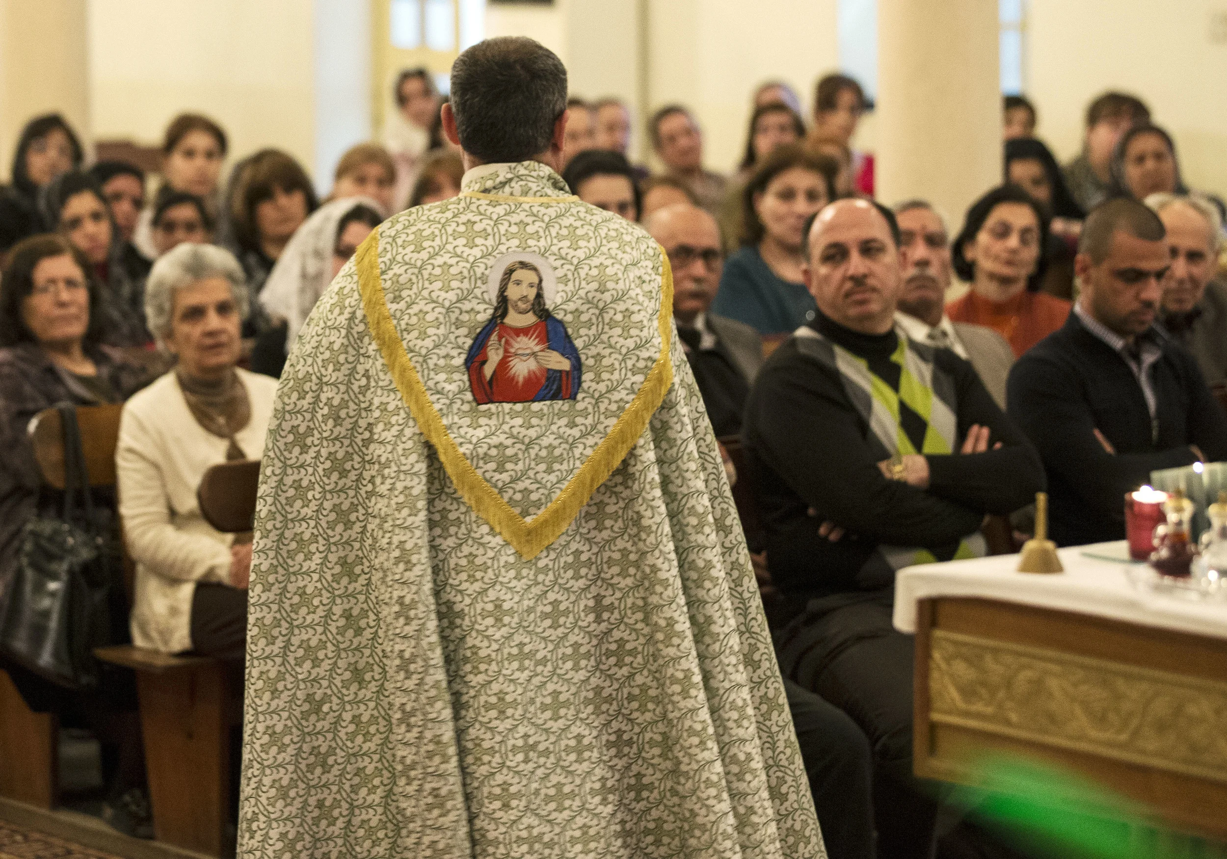  The congregation listen to a sermon at the 'Sacred Heart' church in Baghdad, Iraq. March 2013. 