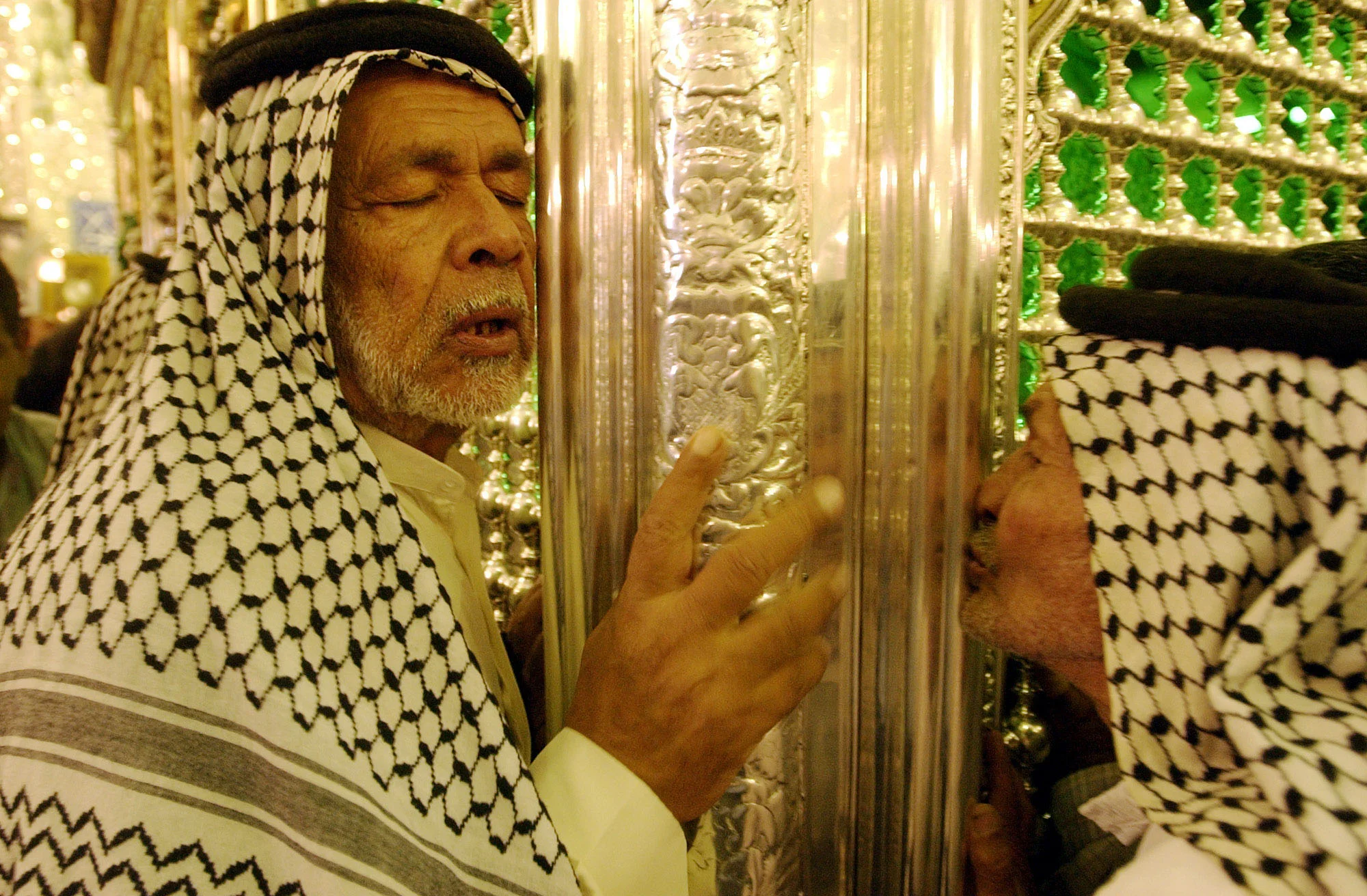 Iraqi Shia muslims pray at the Al-Abbas shrine in the city of Kerbala. October 2002.