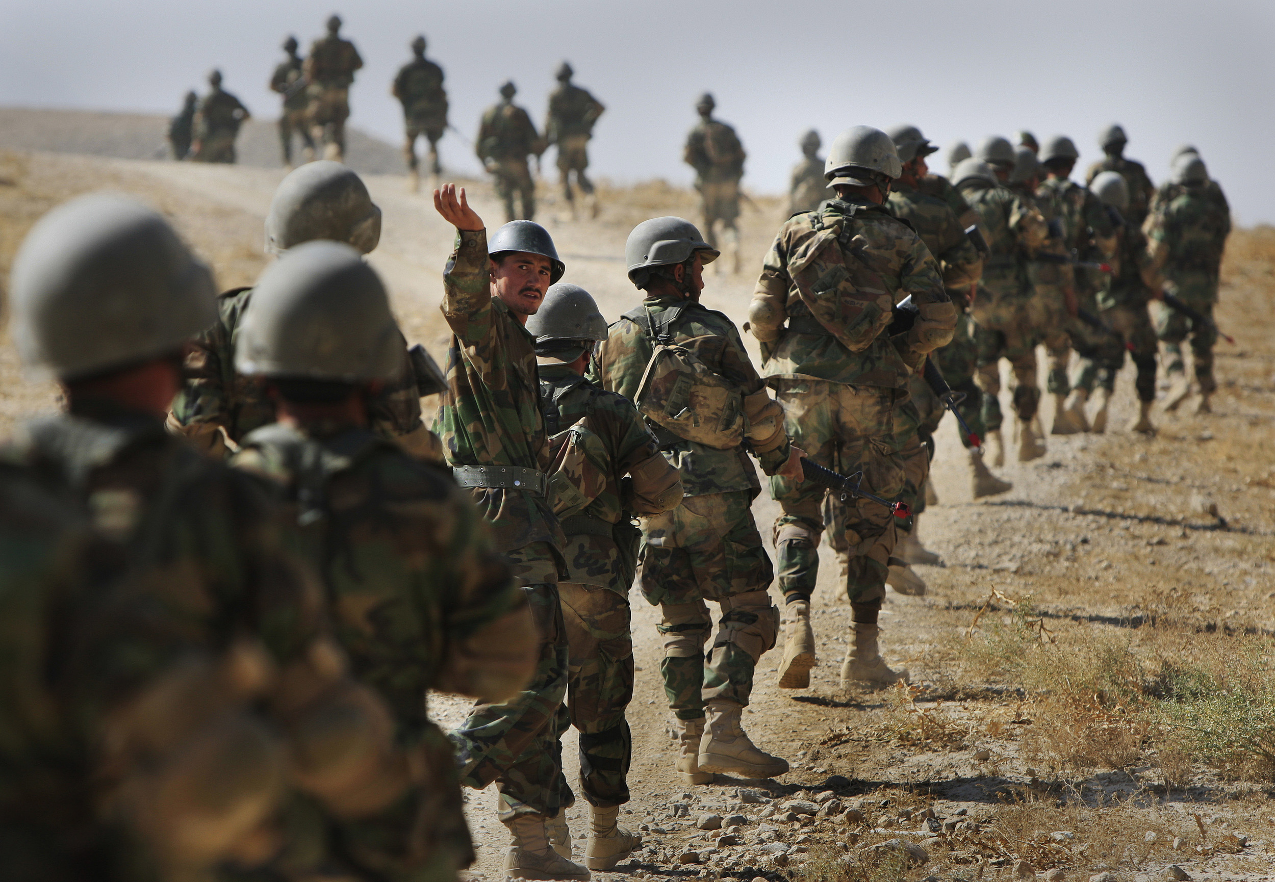 Afghan National Army recruits rehearse patrolling as part of their training for active duty at the Kabul Military Training Centre. October 2009.