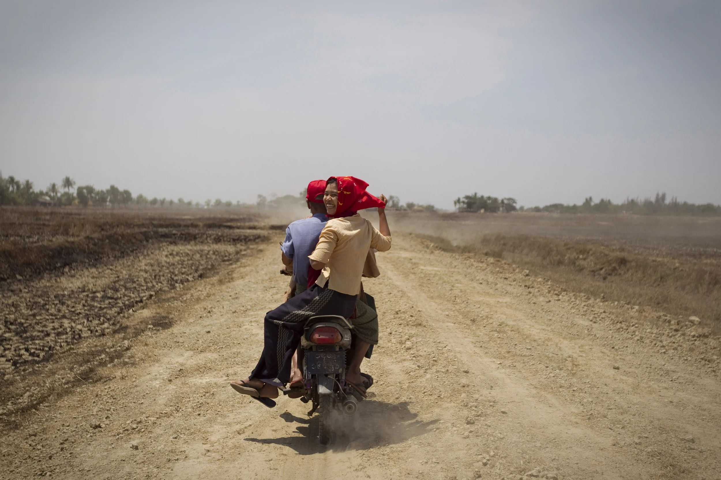  Aung San Suu Kyi campaign workers wearing red NLD party colours, in her rural constituency of Khawhmu, close to Burma's former capital, Rangoon. March 2012. 