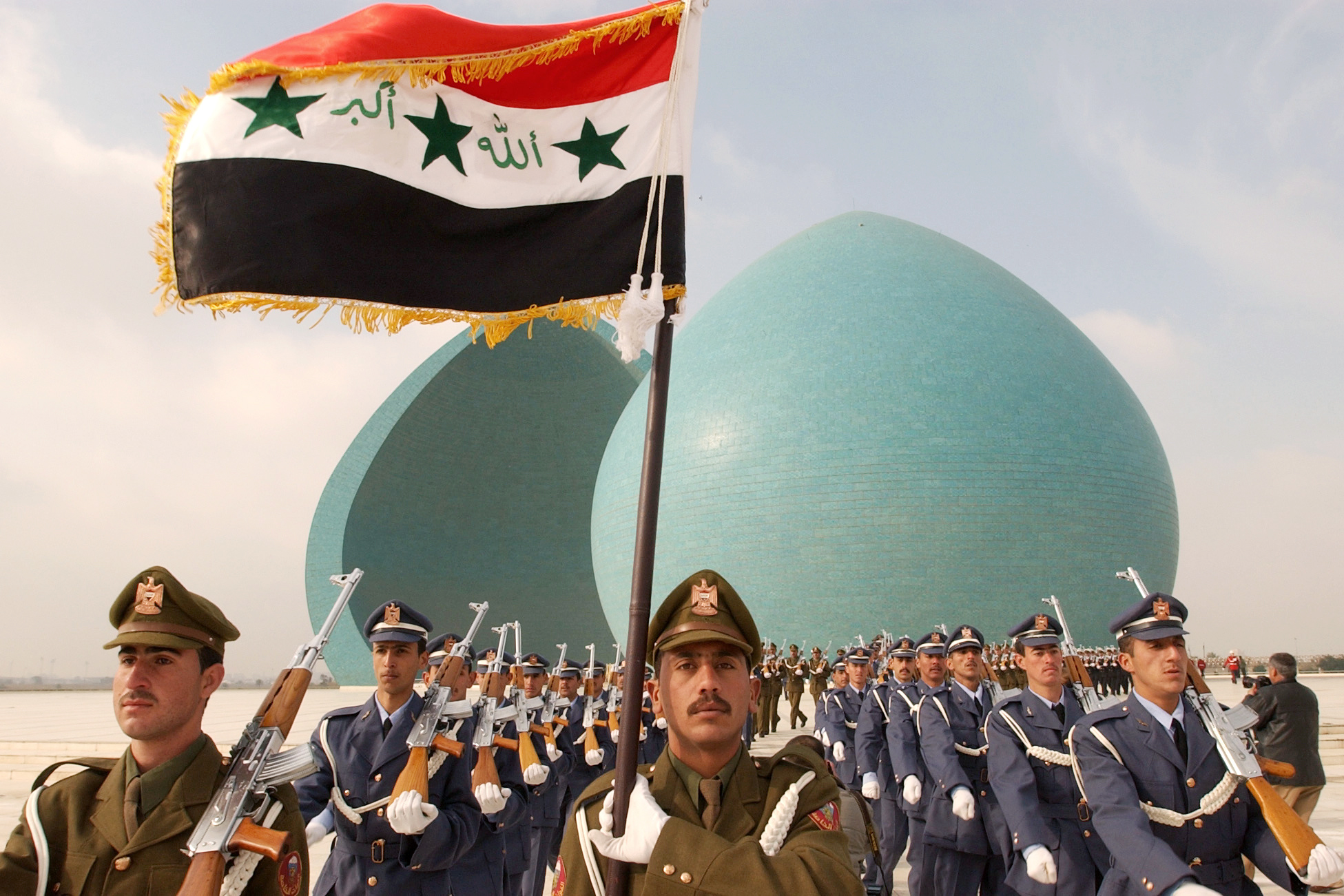 Iraqi military parade in front of the Martyr's Monument in Baghdad during a memorial service. February 2003.