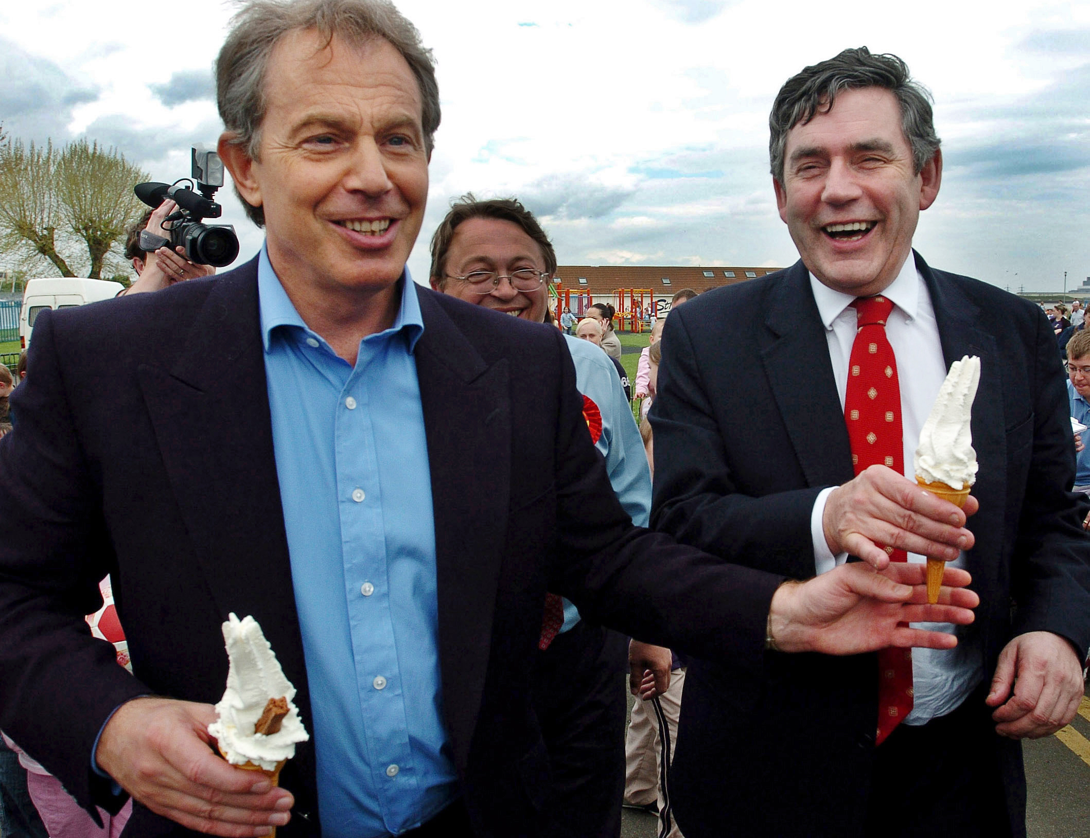 Tony Blair hands Gordon Brown a '99' ice cream on a visit to Gillingham, Kent, during the election campaign of May, 2005.