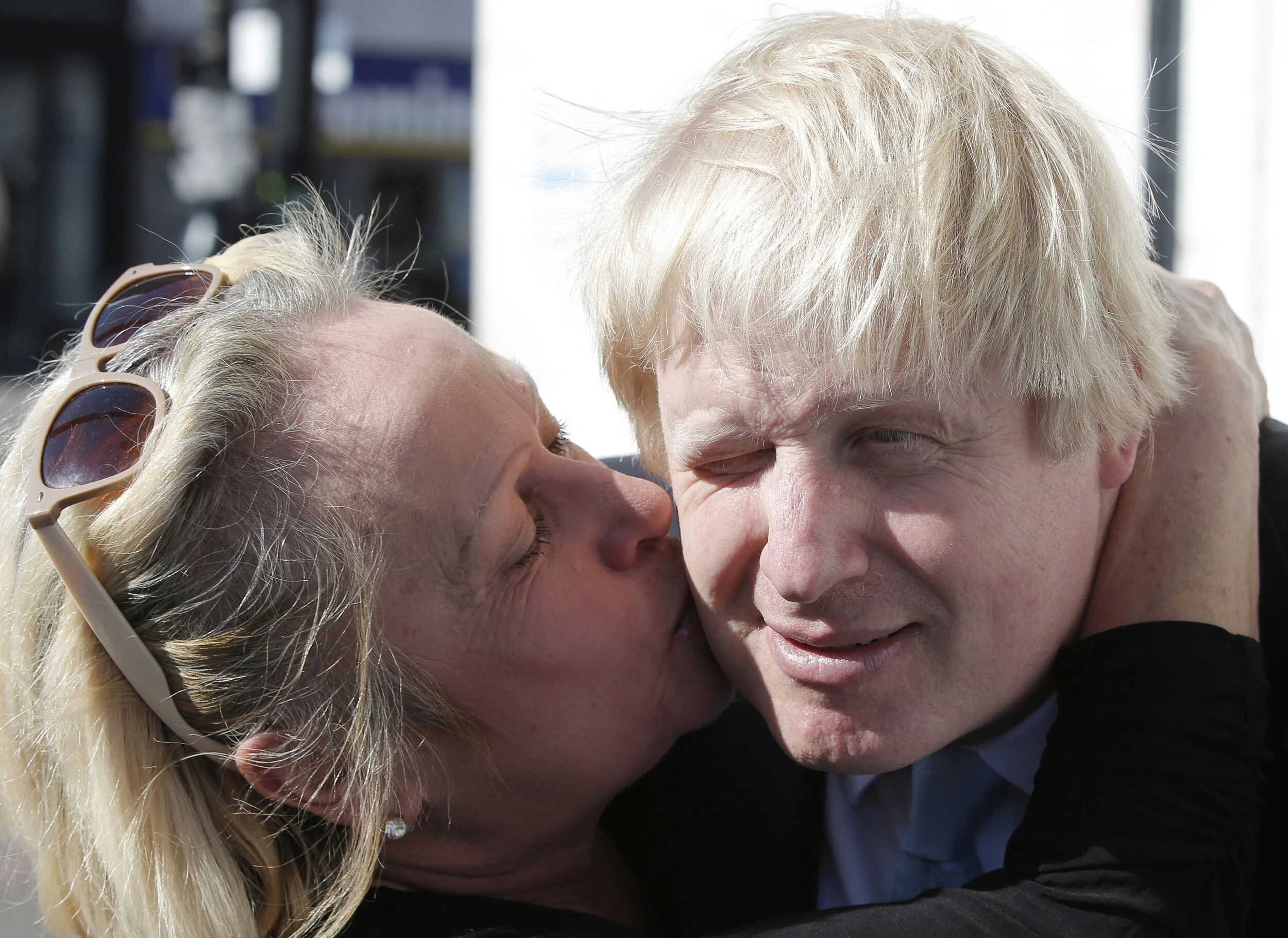  London's Mayor Boris Johnson receives a kiss from a supporter whilst campaigning for the local Conservative candidate in Finchley, north London, April 21, 2015 