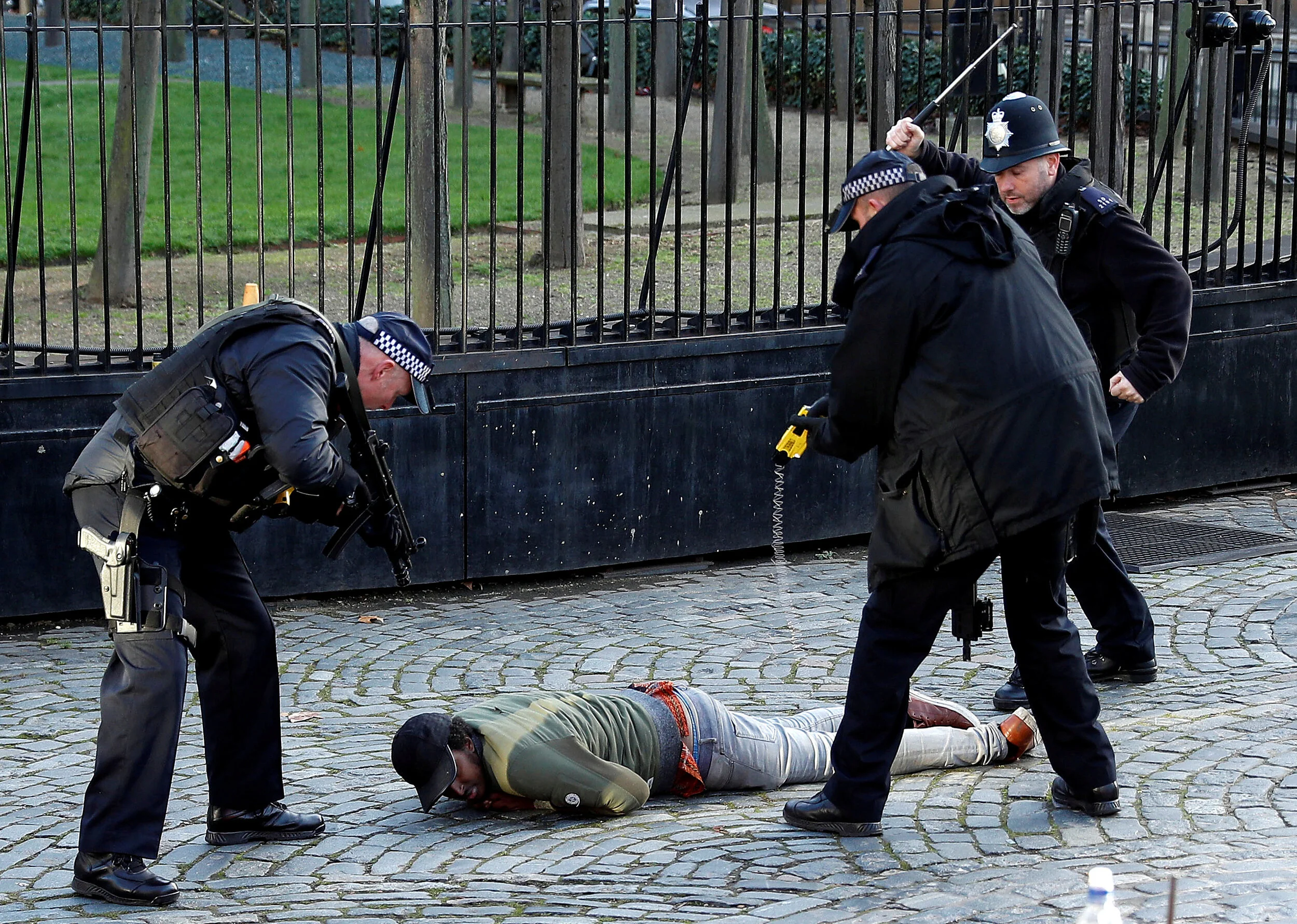  Armed police taser a man inside the grounds of the Houses of Parliament in London, Britain, December 11, 2018 