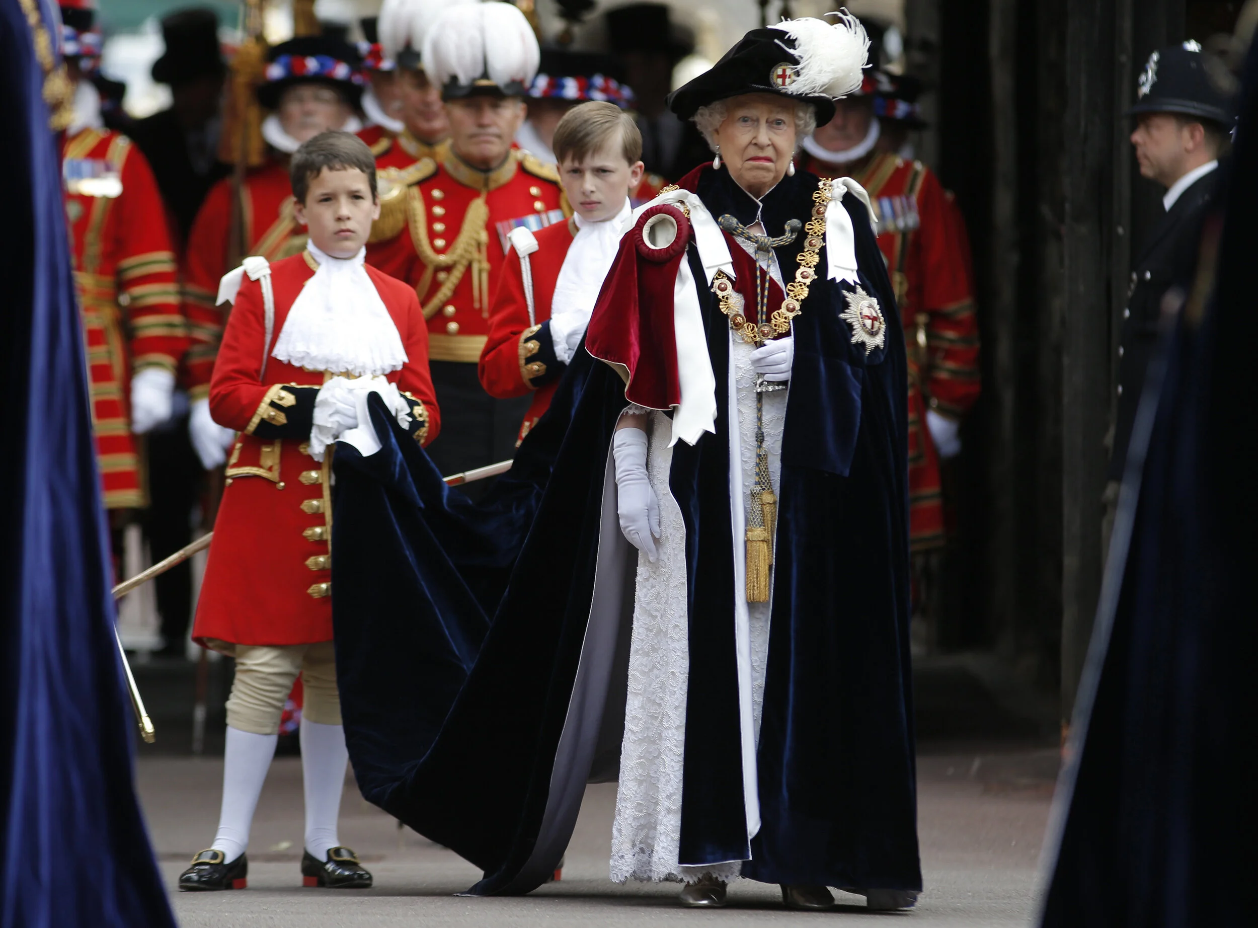  Britain's Queen Elizabeth walks in procession as she attends the annual Order of the Garter Service at St George's Chapel at Windsor Castle in Windsor, Britain, June 15, 2015. 