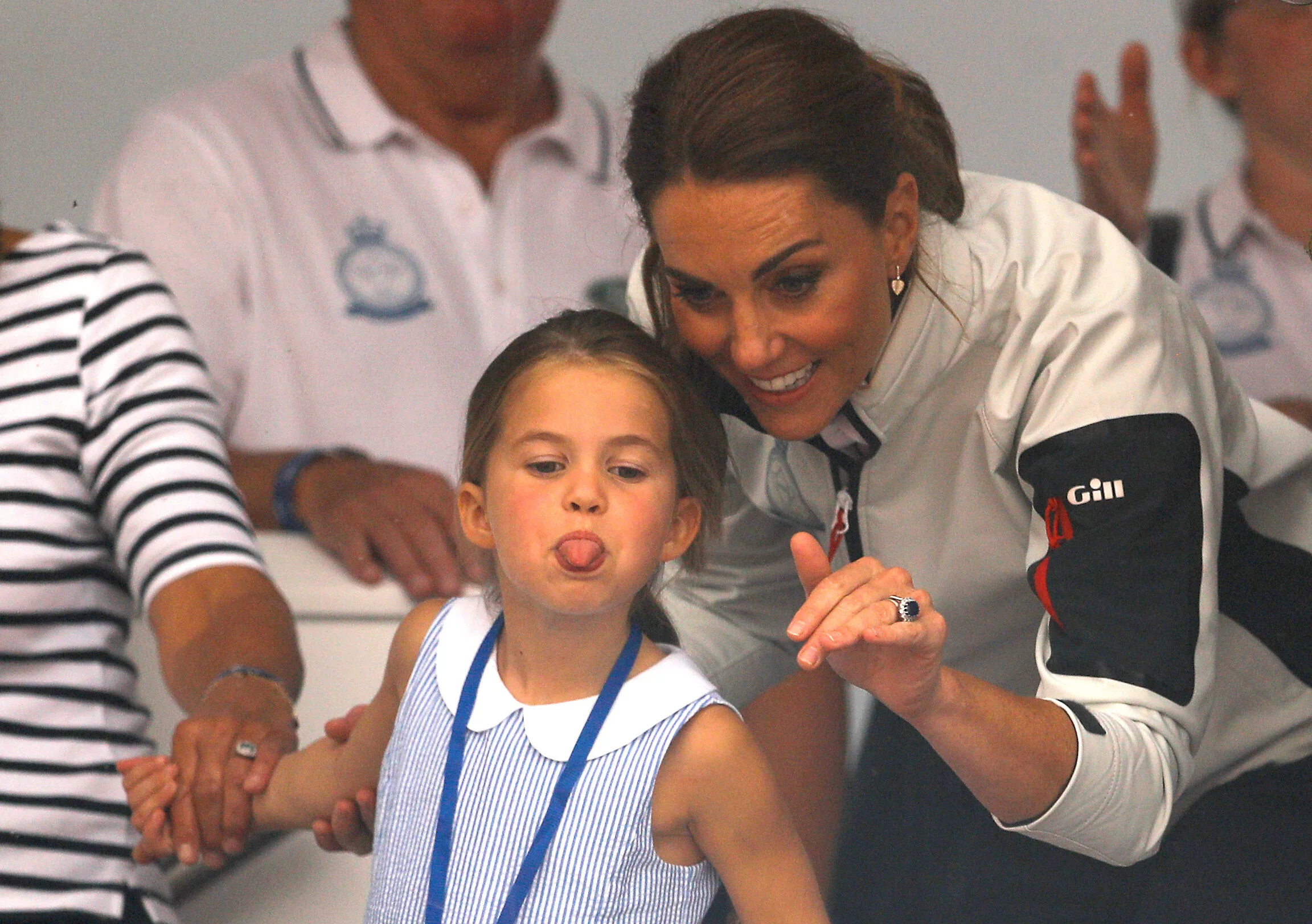 Britain's Princess Charlotte sticks her tongue out next to her mother, Catherine Duchess of Cambridge, before a presentation ceremony following the King's Cup Regatta in Isle of Wight, Britain, August 8, 2019. 
