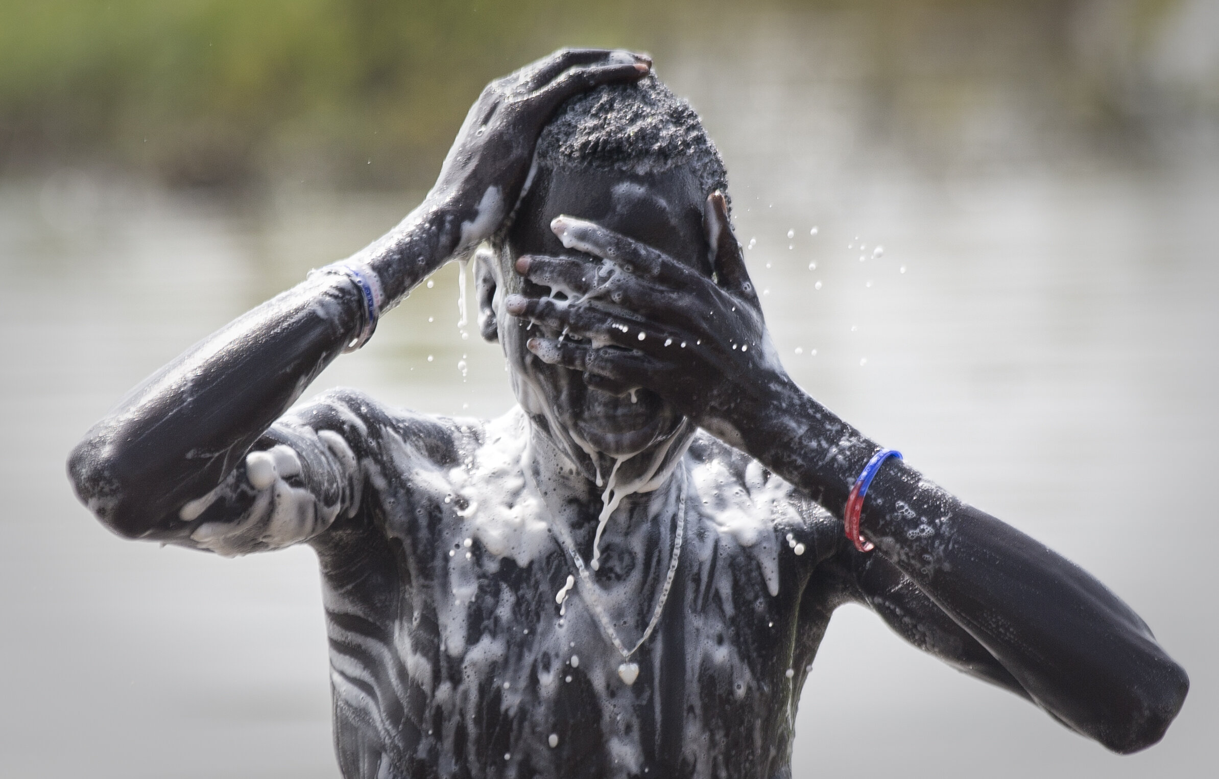  A South Sudanese refugee washes in the floodwaters of the Leithchour refugee camp in Ethiopia which houses 47,806 people. November 7, 2014 