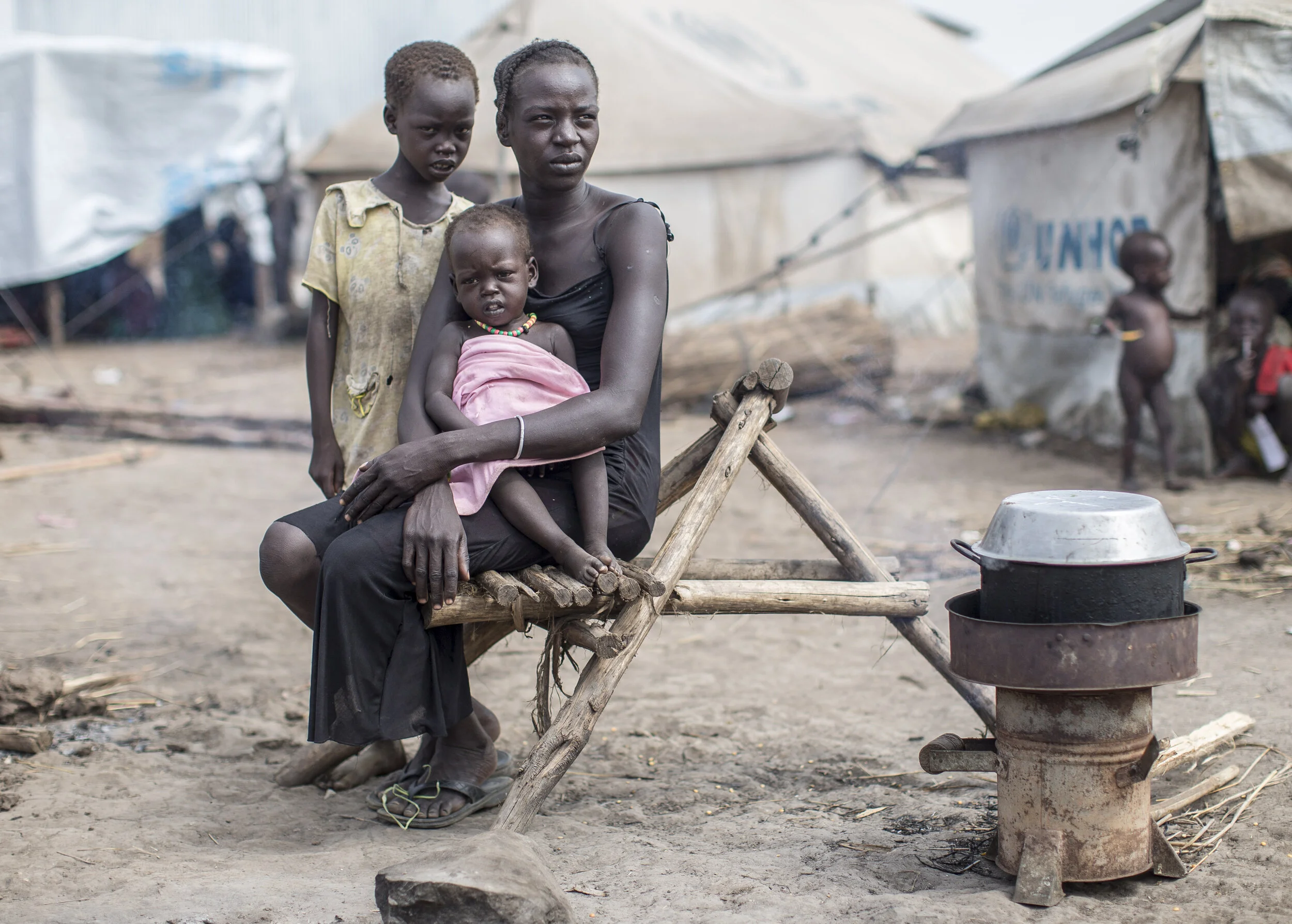  South Sudanese refugee, Nyabang Yual, 24, her baby and her daughter Nyakume, at the flooded Leitchour refugee camp, in Ethiopia.  November 7, 2014 