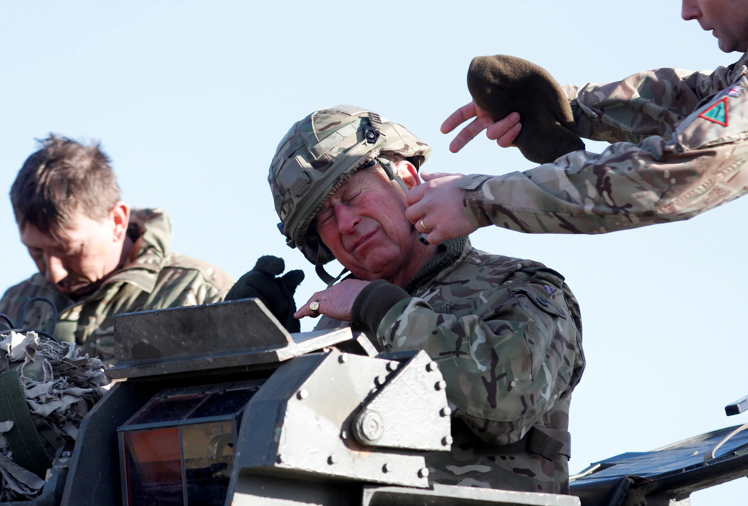  Britain's Prince Charles has his helmet adjusted after taking a ride on a Warrior  Armoured Vehicle during a visit to The Mercian Regiment at their barracks in Bulford, Wiltshire, Britain, February 9, 2018.  