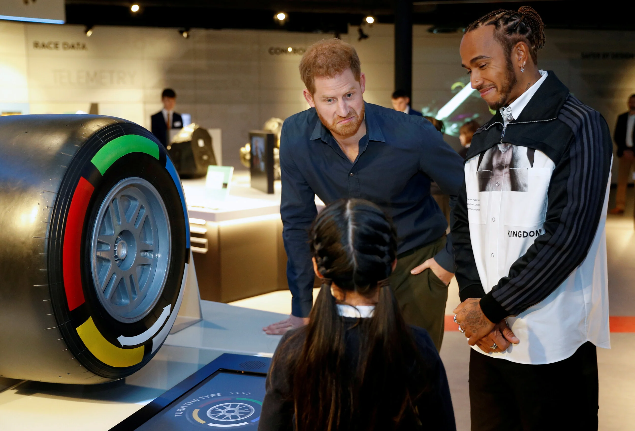  Britain's Prince Harry and Formula One World Champion Lewis Hamilton talk to school children as they visit Silverstone circuit, in Towcester, Britain, March 6, 2020.  