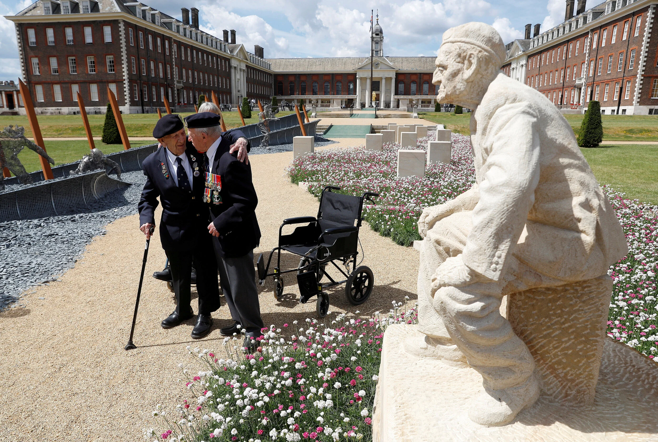  D-Day veterans walk through the 'D-Day 75 Garden' on display at the RHS Chelsea Flower Show in London, Britain, May 25, 2019.  
