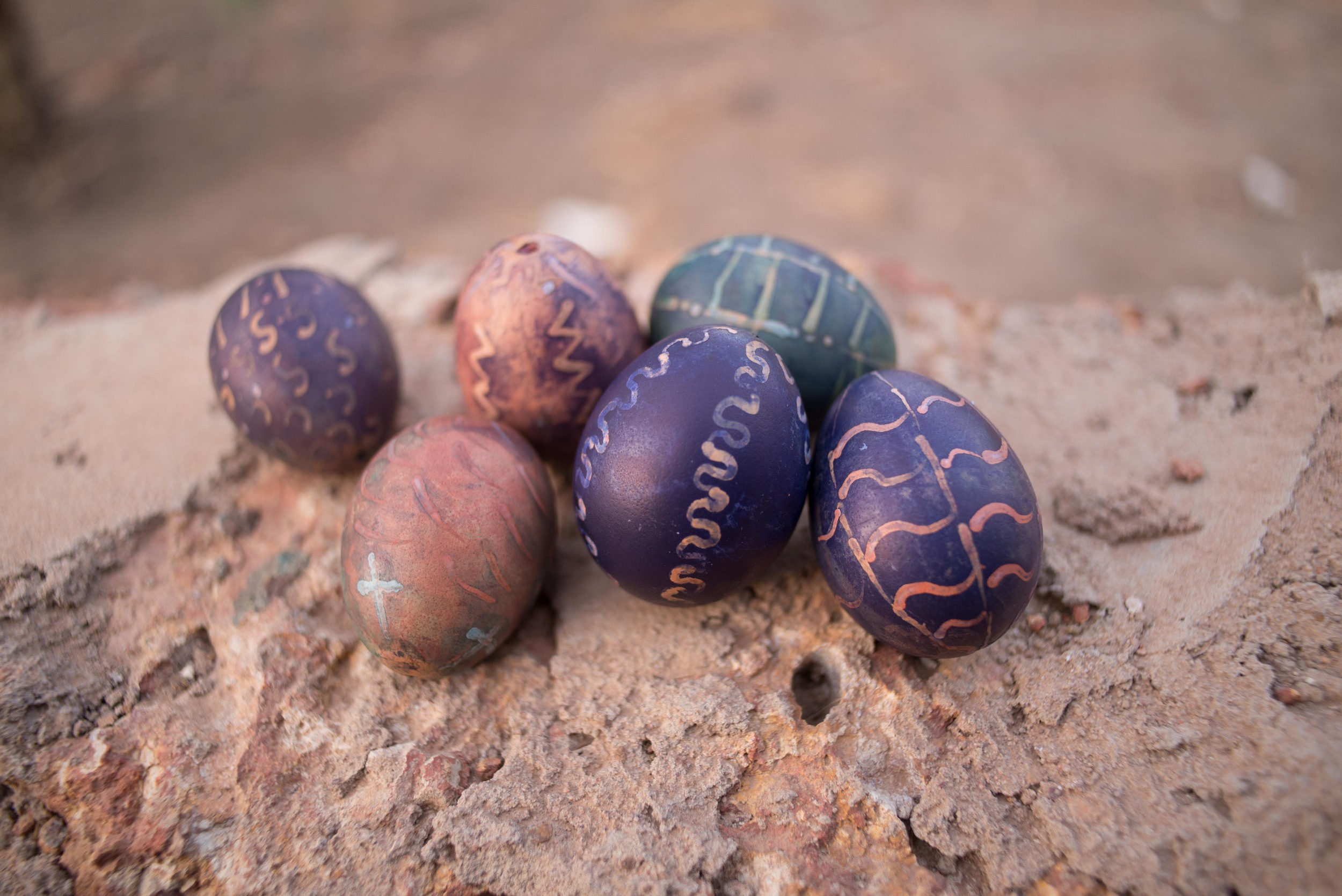 The ugliest Easter Eggs in the world, colored with powdered clothing dye and vinegar with wax resist motifs courtesy of a box of candles and the head of a pin.