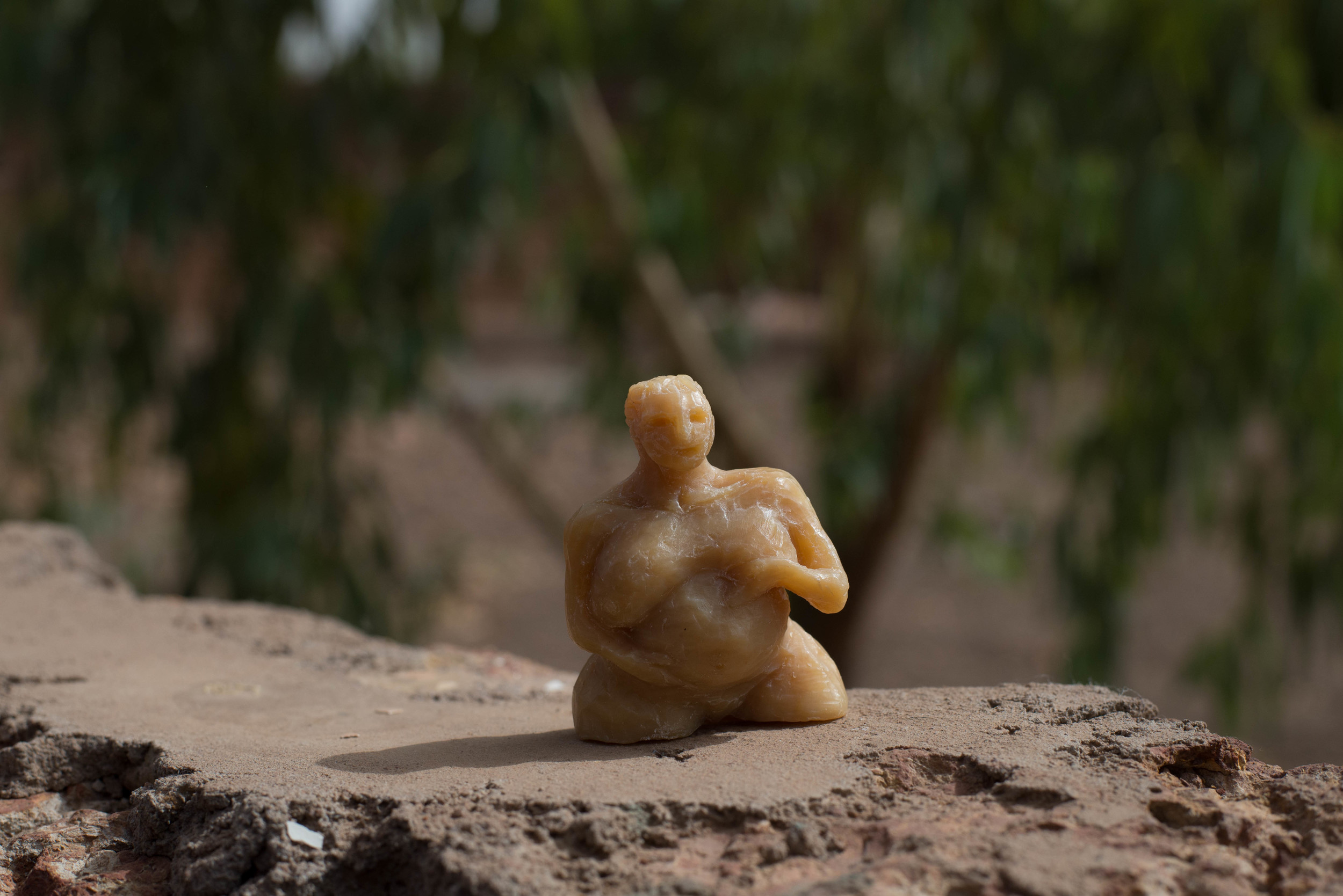  Soap figurine of a pregnant woman. There are at least four pregenant women in my neighbor's family compound, so after I carved this and gave it to their family. 