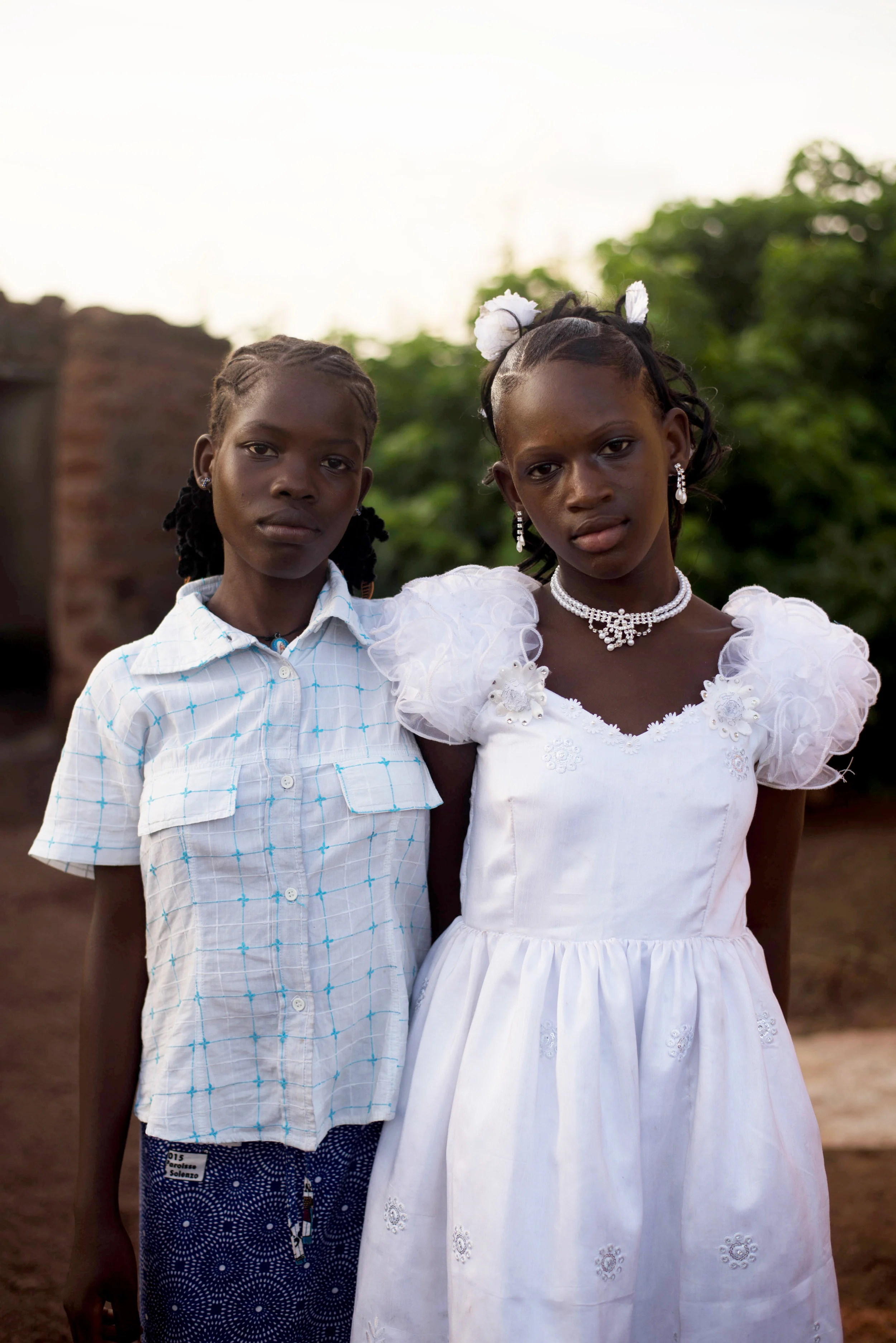 Badjah (left) and Kevine (right), Rita's daughter, on the day of Kevine's baptism.