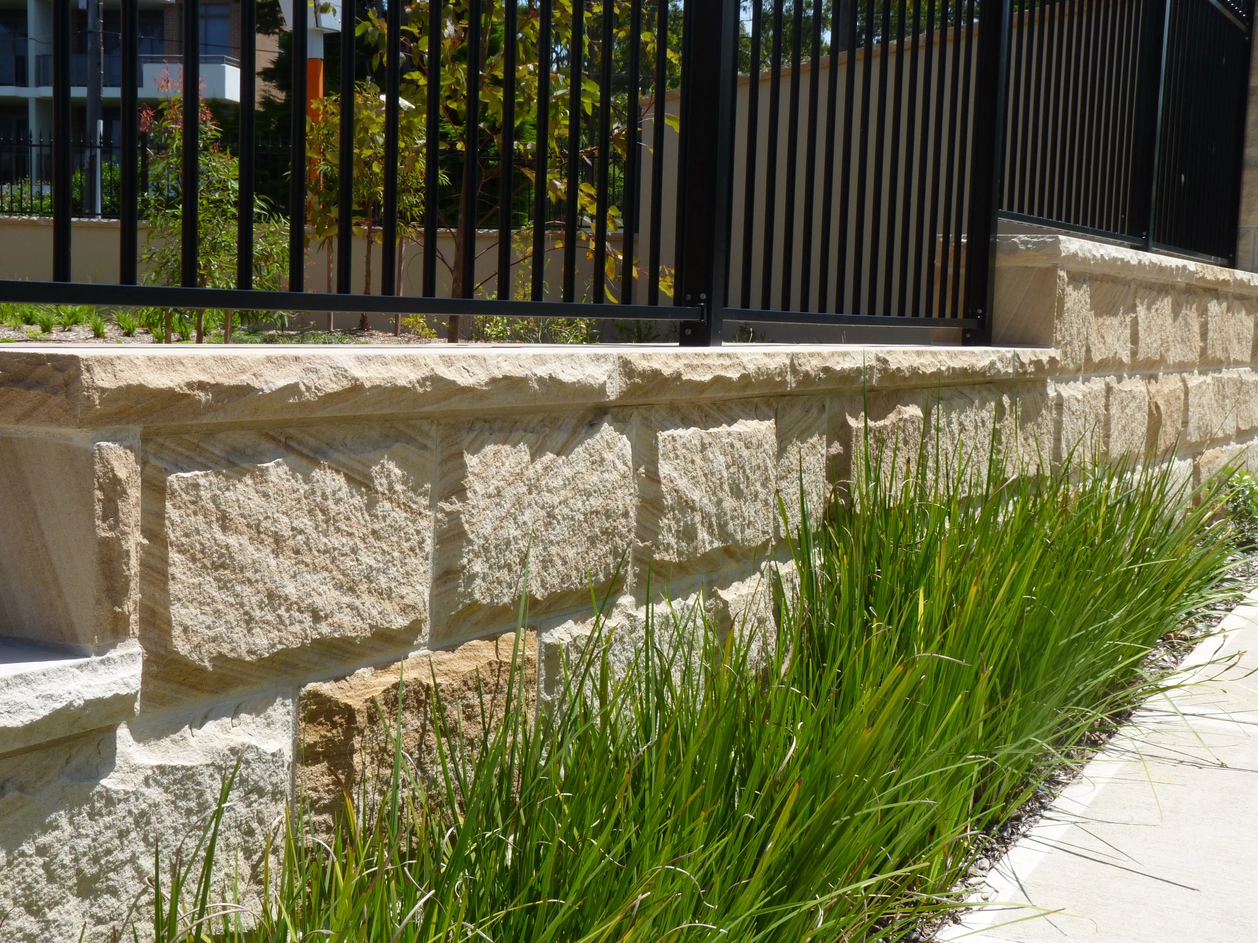 Brown - Rockfaced - Fence Retaining wall.JPG